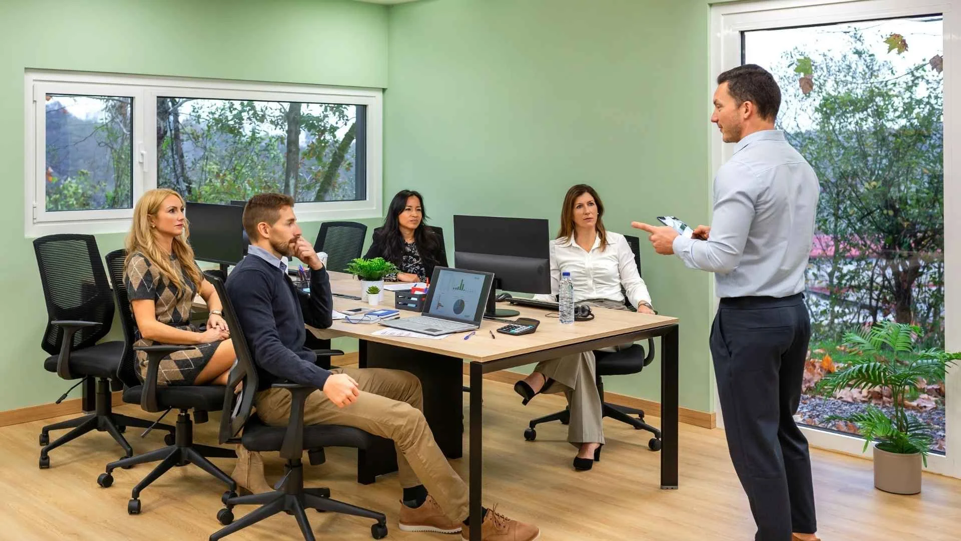 leader leads corporate team at work