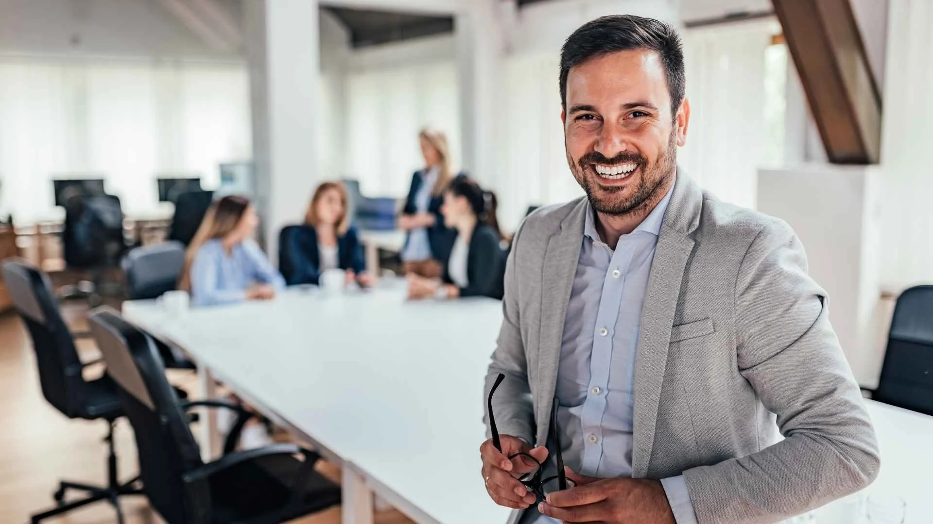 man with glasses in conference room