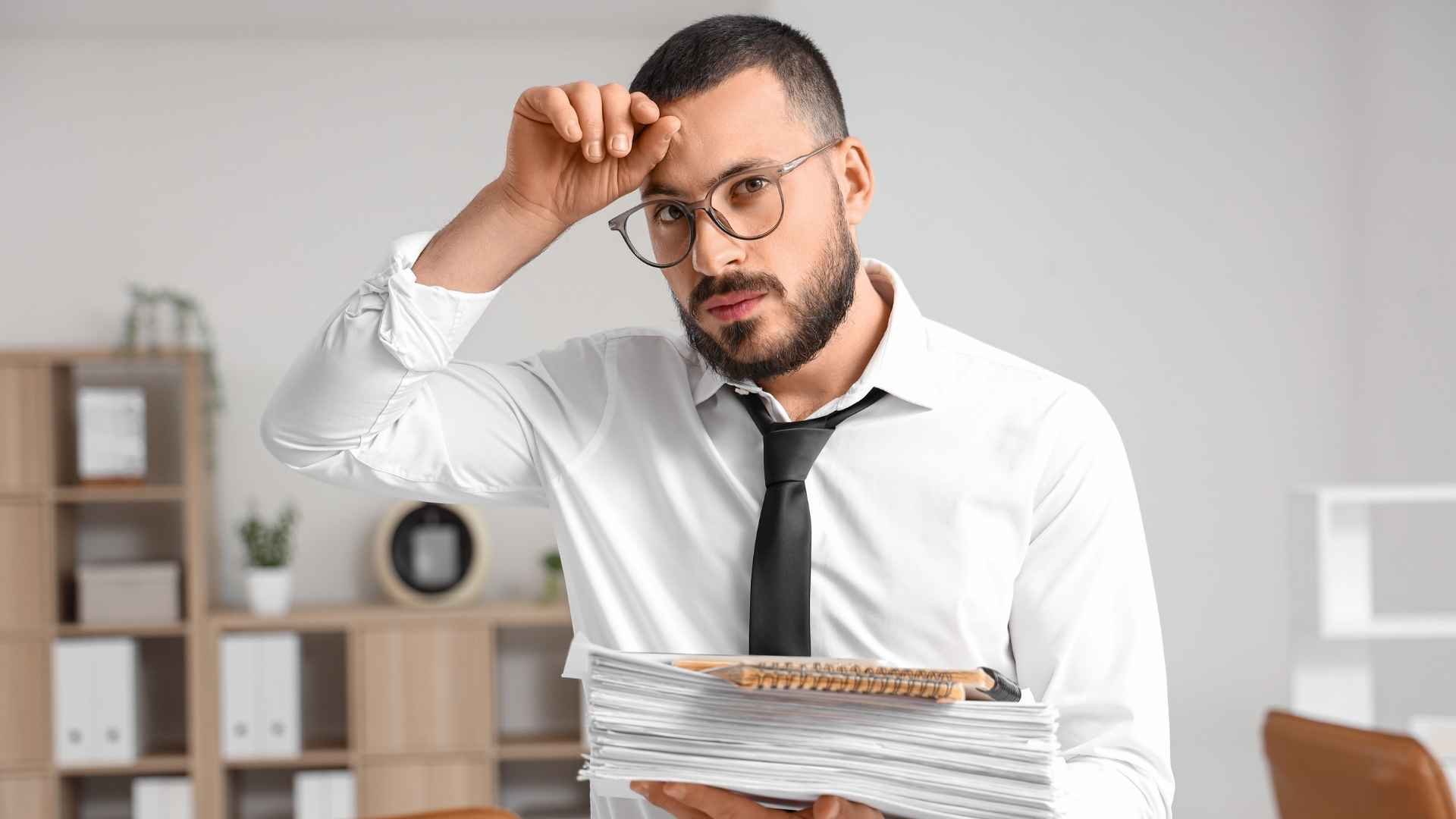 overwhelmed man at work