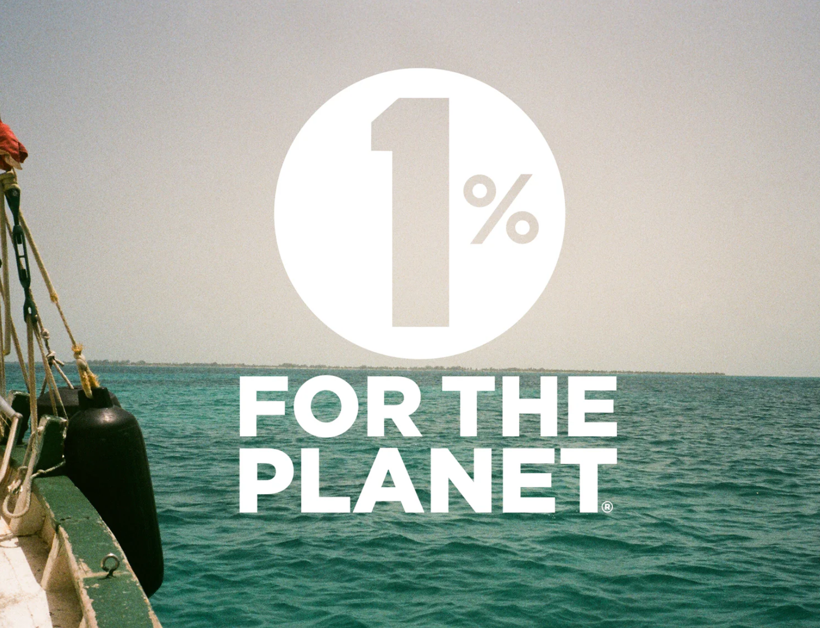 Sailboat on ocean with "1% for the Planet" logo overlay.