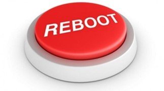 Red button labeled "REBOOT" on a white background