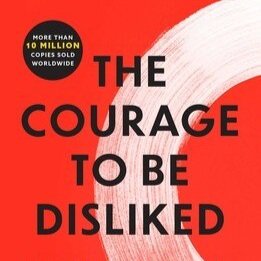 "The Courage to Be Disliked" book cover with a red background and minimalist white brushstroke.