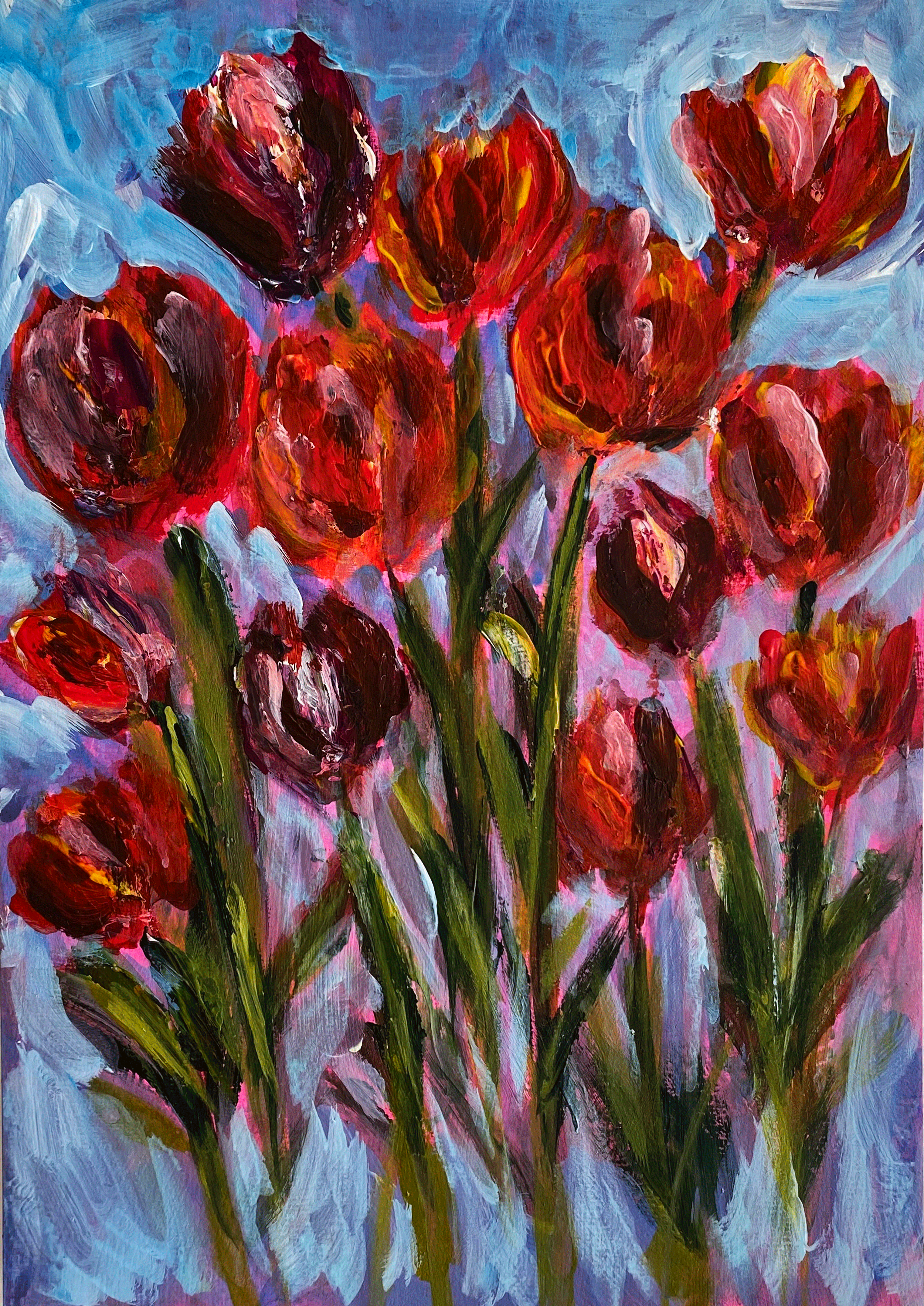 red and pink spring tulips on blue background.png