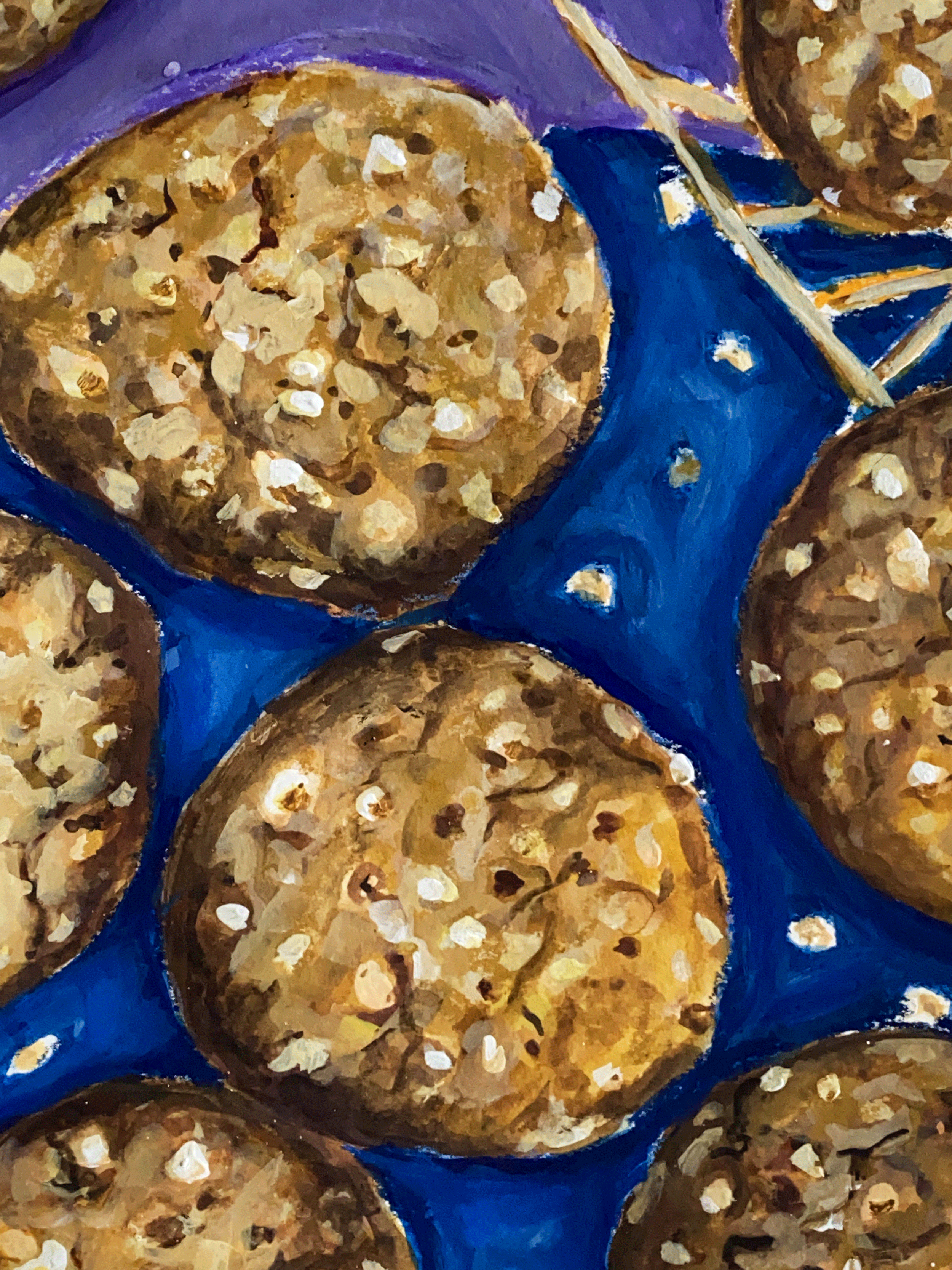 white chocolate cookies on blue plate close up.png