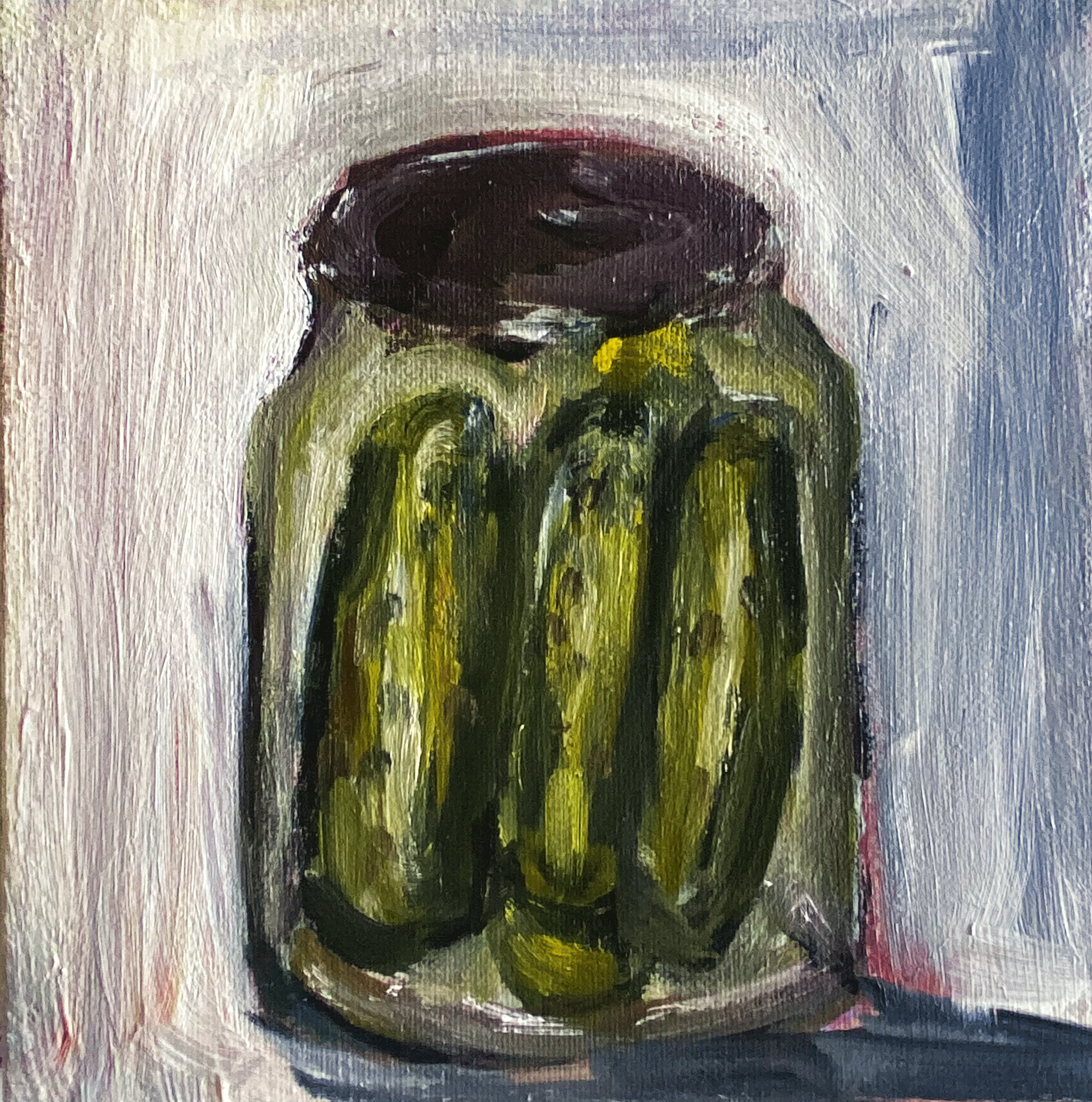 jar of pickles on grey background close up