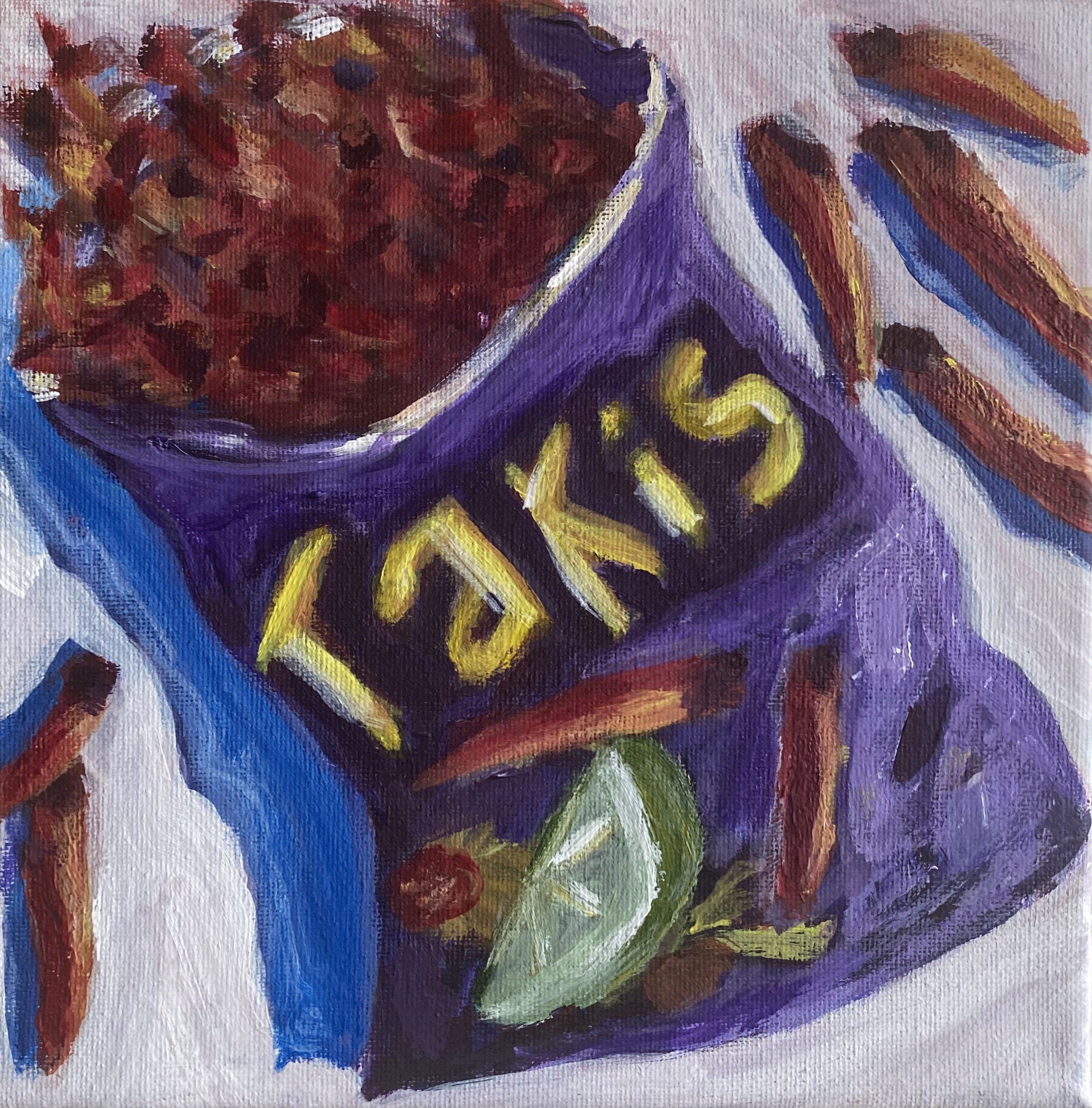 bag of taki chips purple on white background
