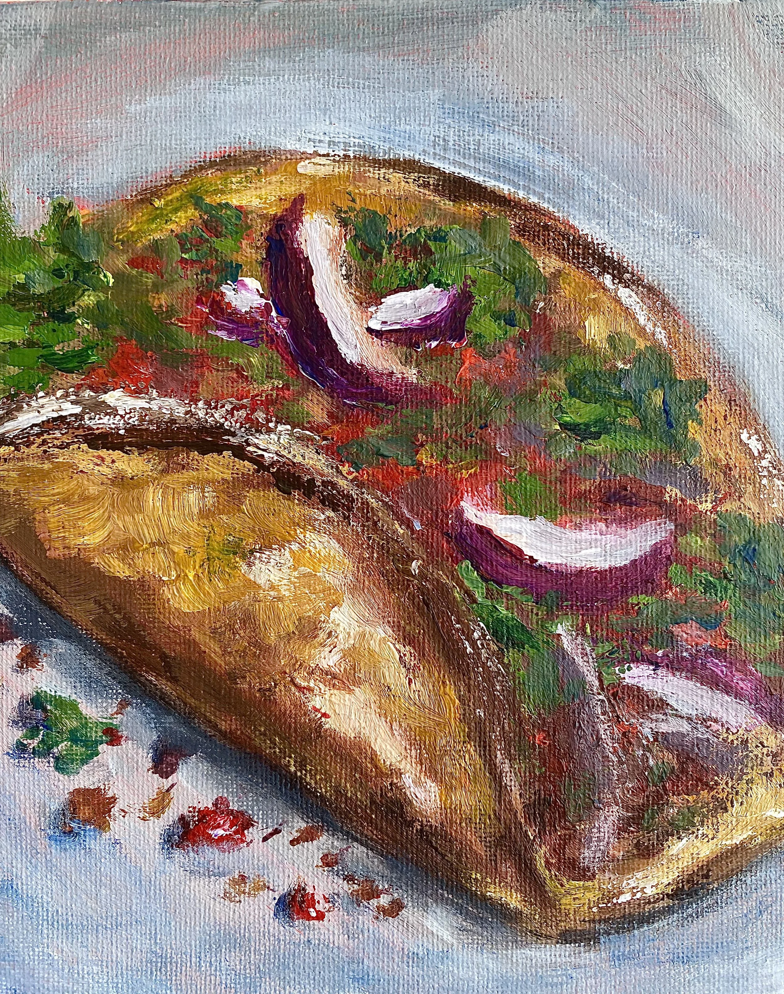 beef taco with lettuce, onions, tomatoes on grey background close up