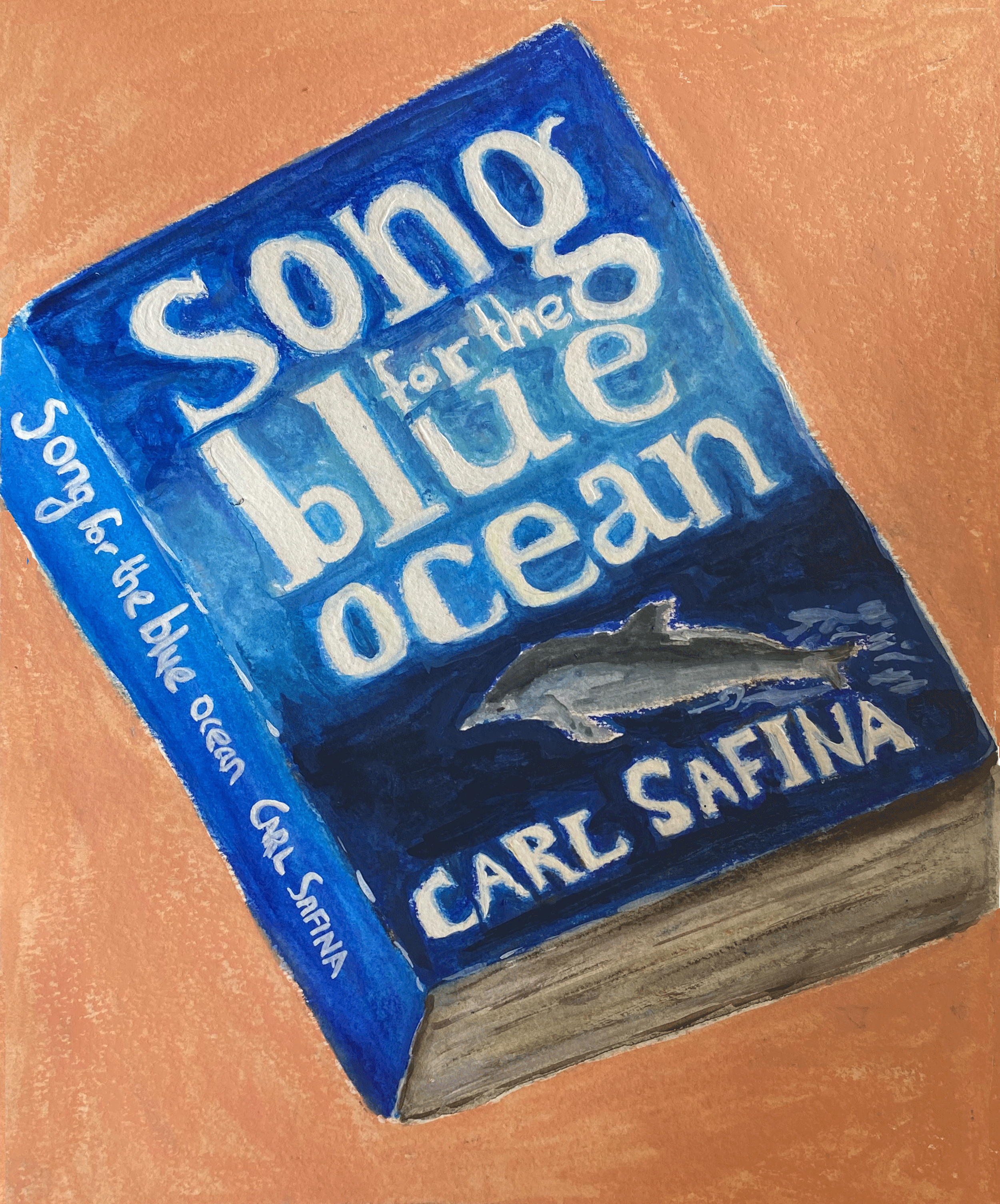 blue book cover on peach background  close up.png