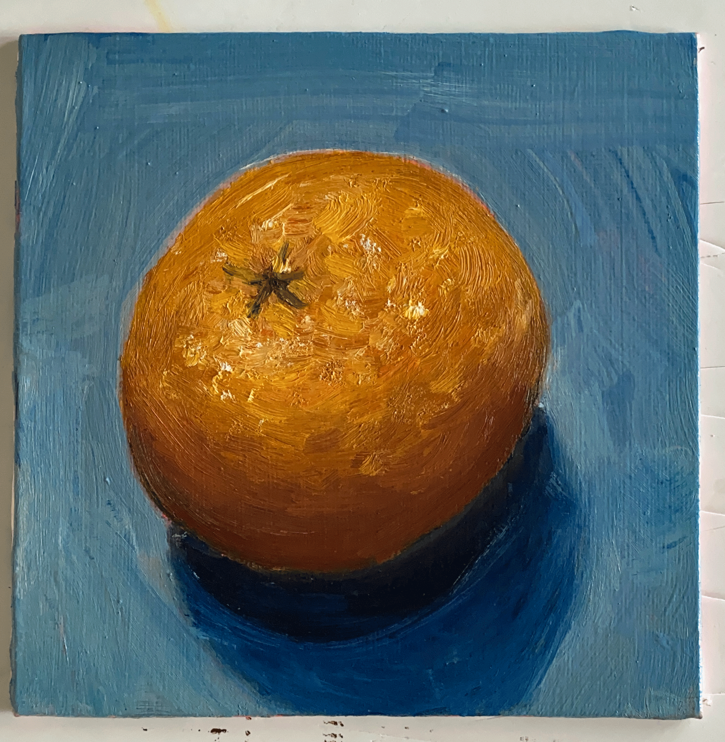 orange on blue background mini painting.png