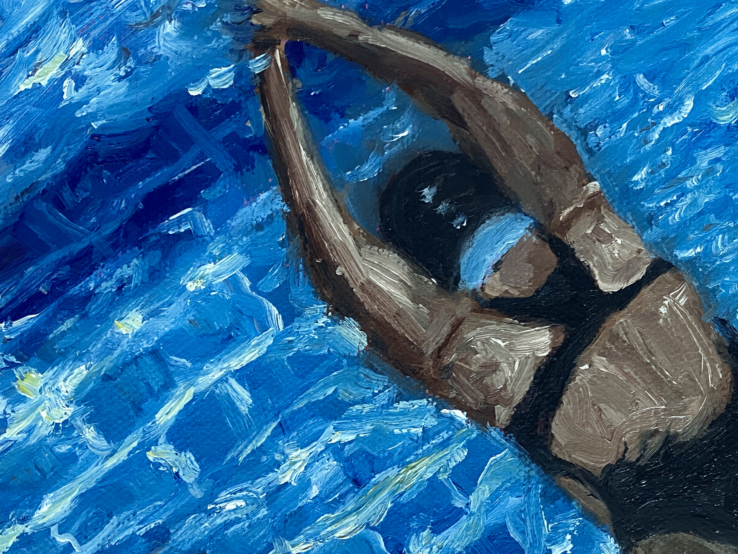 women in black swimsuit swimming view from above.png