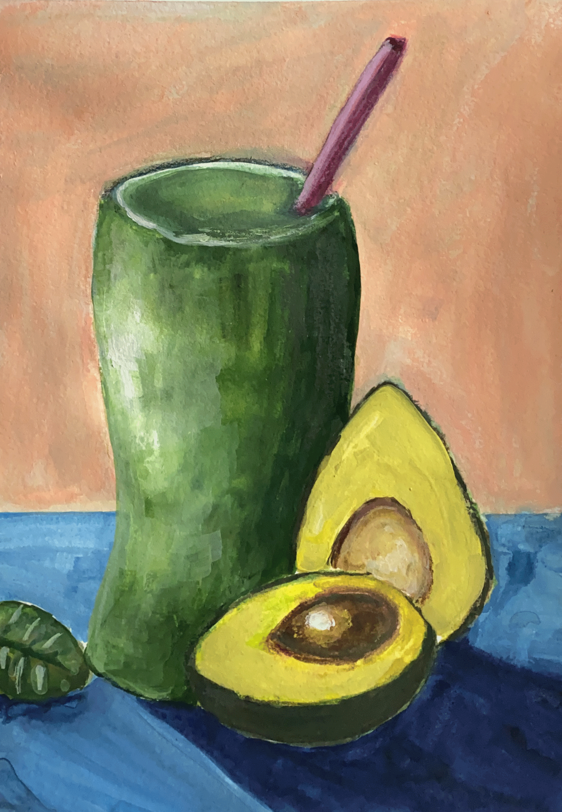 green smoothie with avocado on peach background close up.png