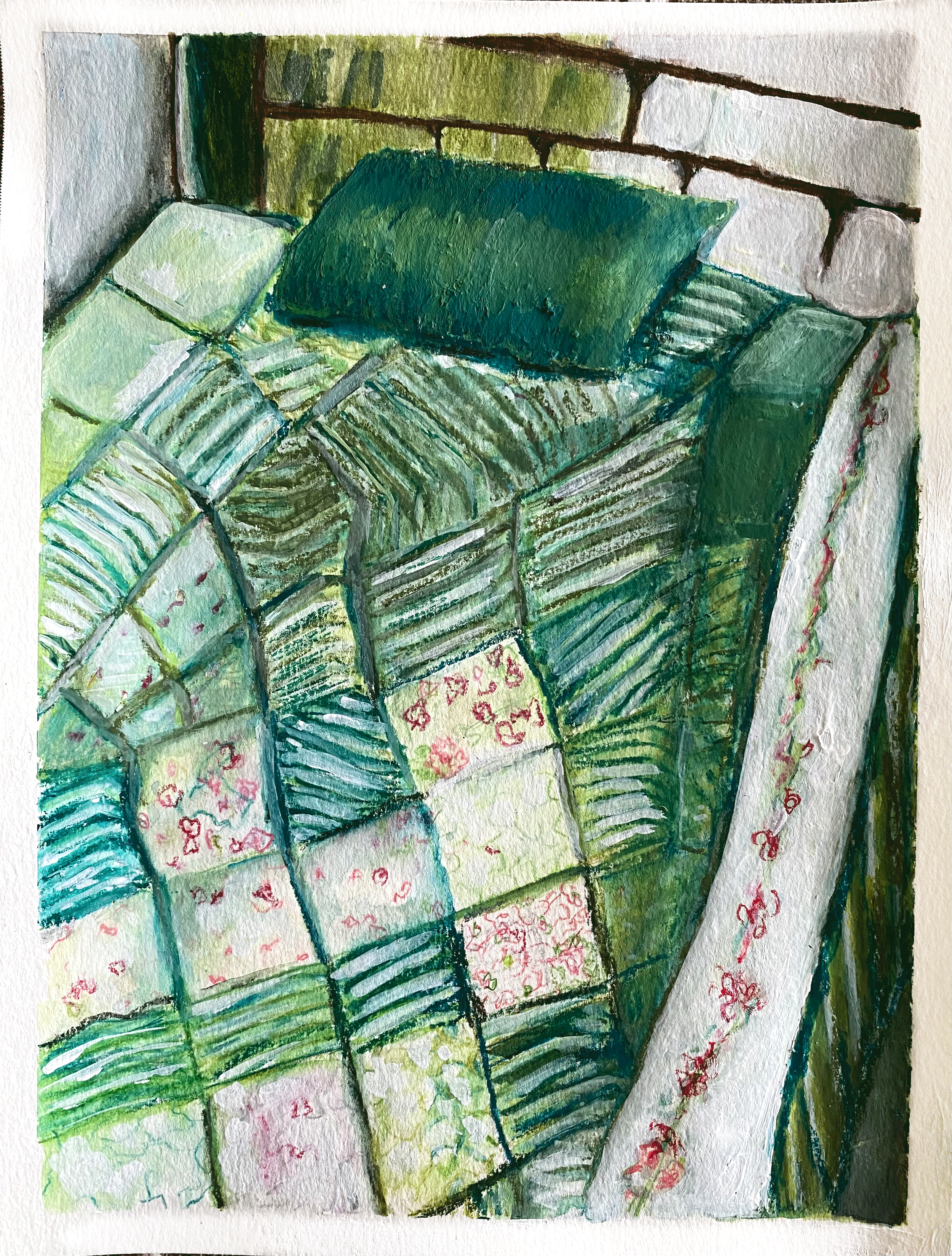bed with green quilted cover and green pillow .png