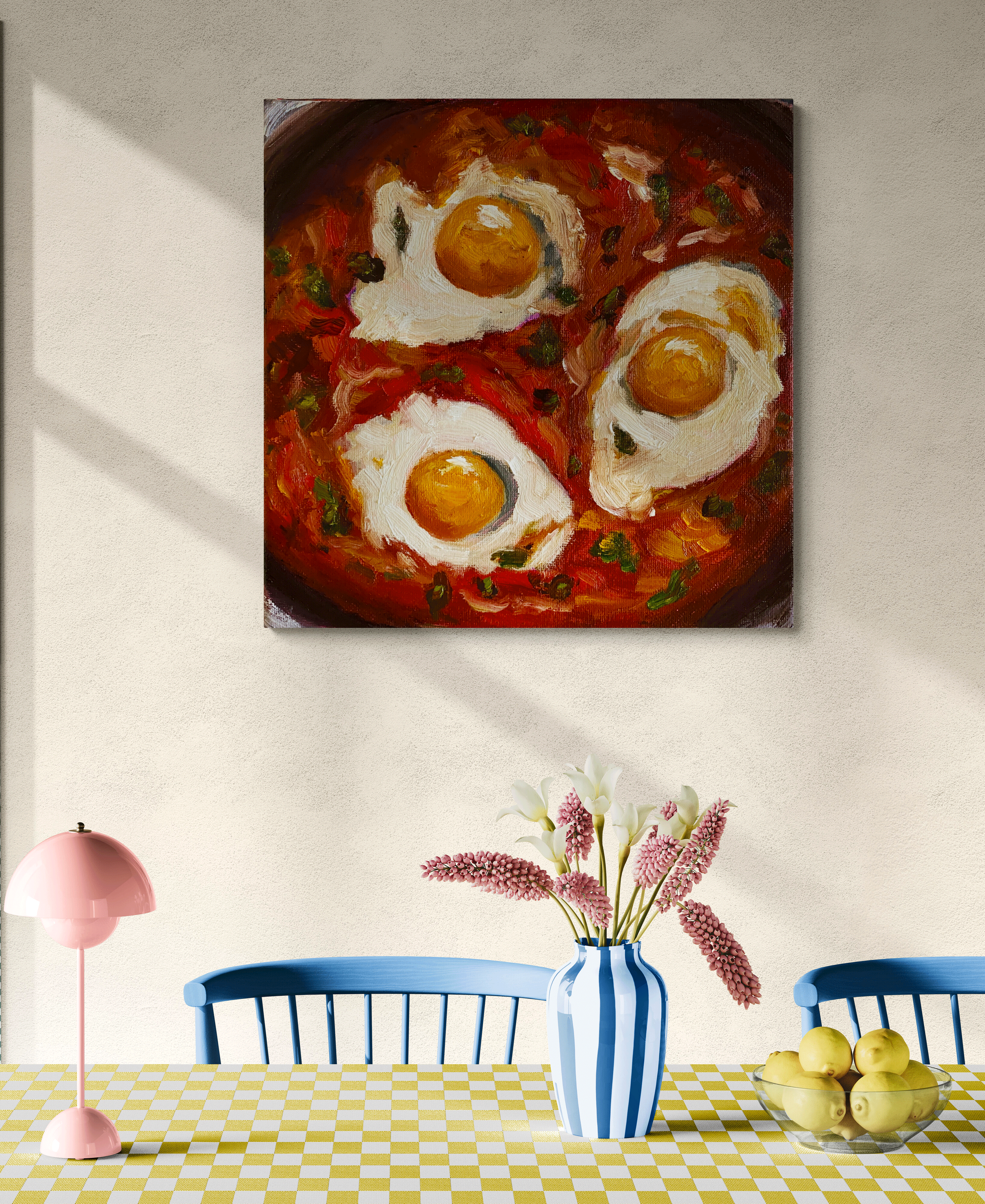 eggs and tomatoes shakshuka painting hung in room.png