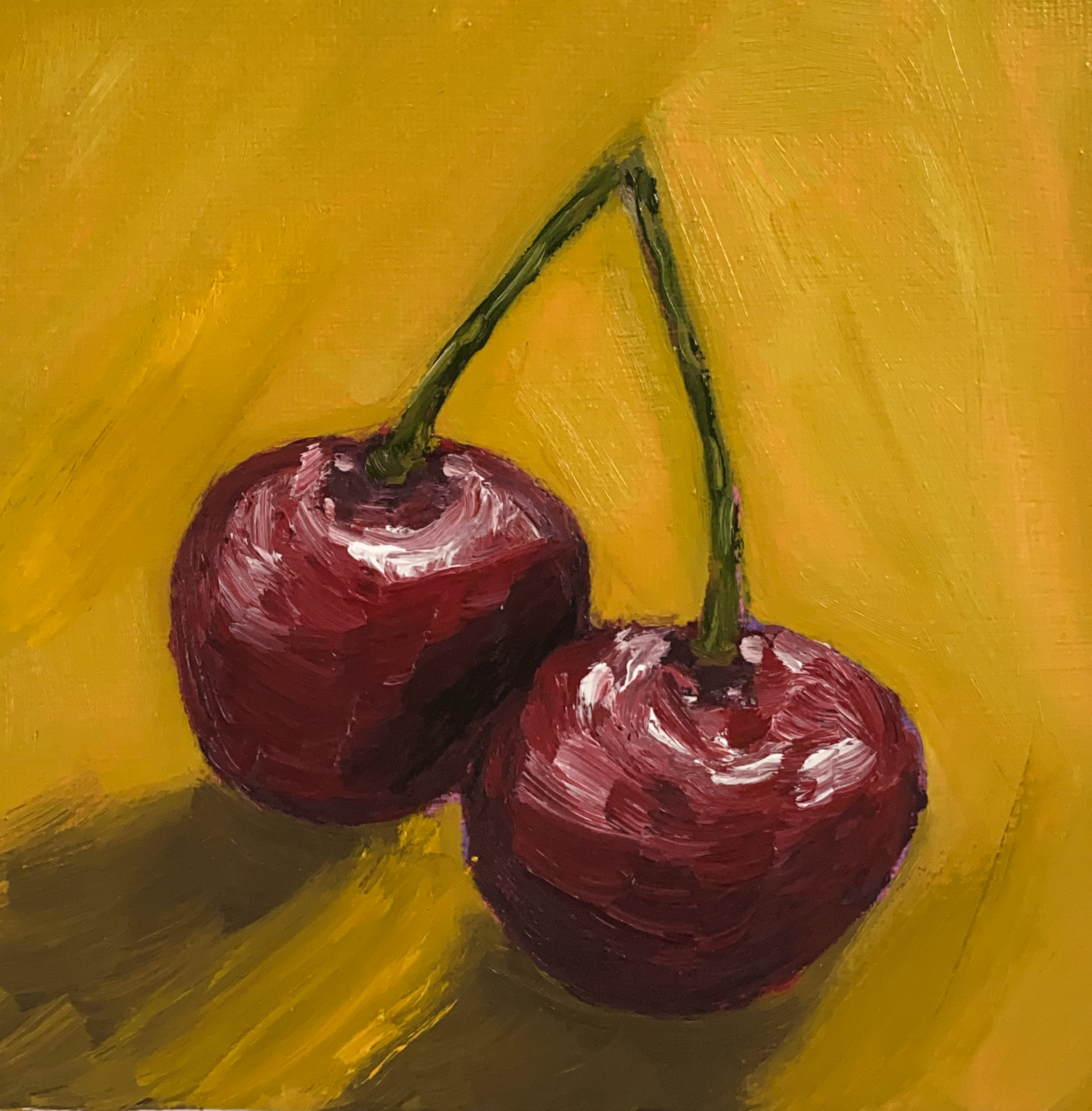 Cherries on yellow background.png