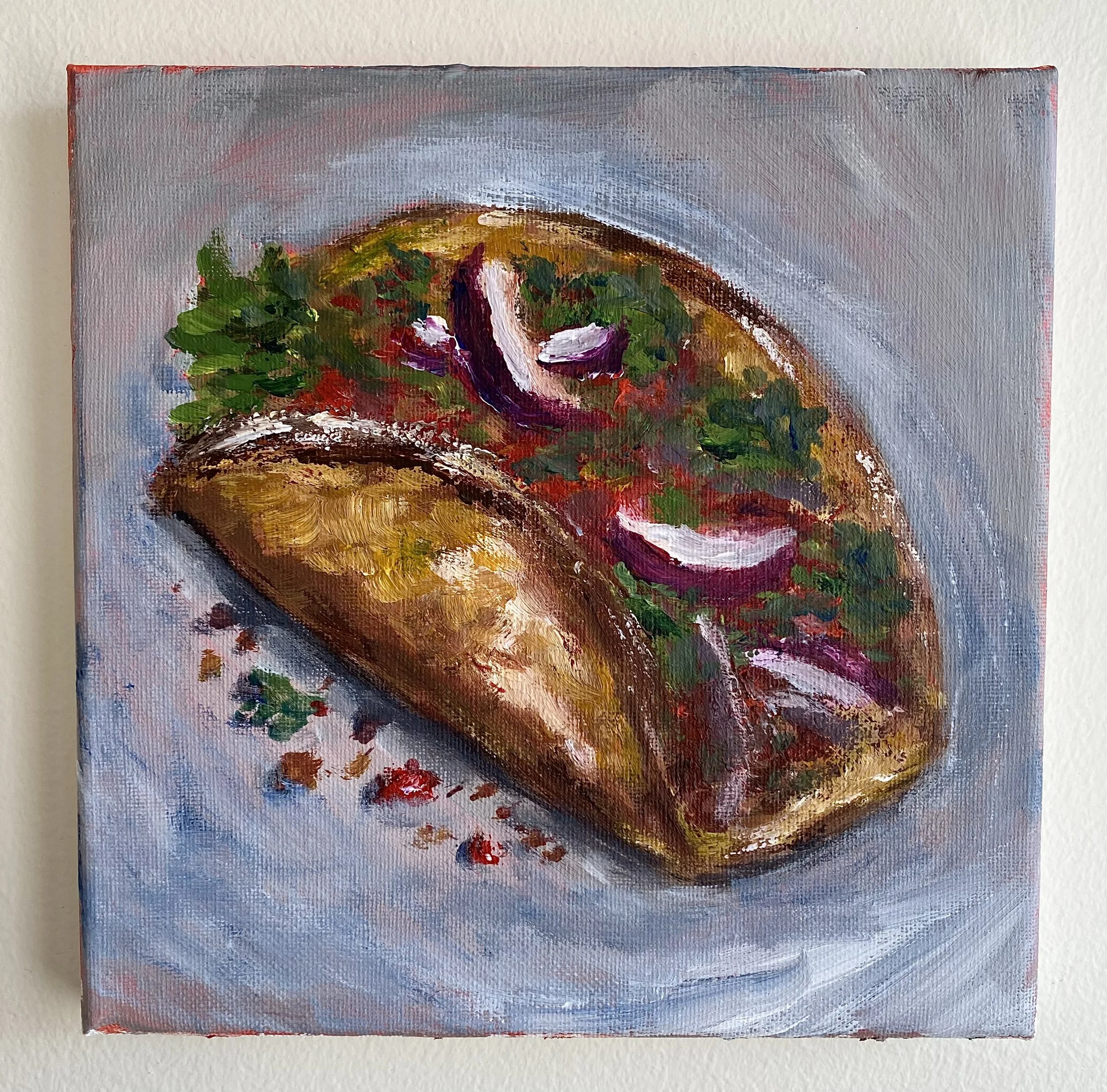 beef taco with lettuce, onions, tomatoes on grey background hung on wall