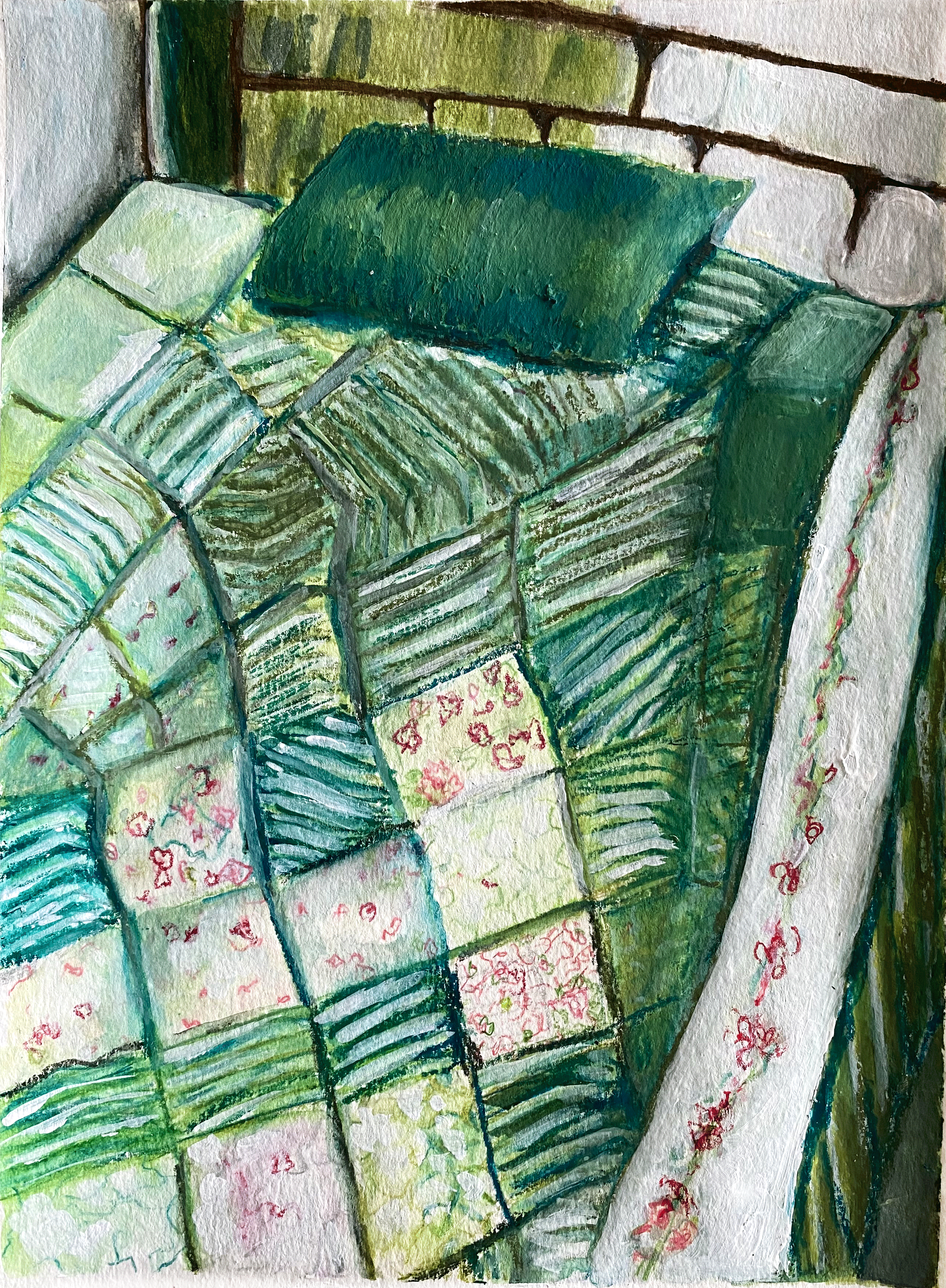 bed with green quilted cover and green pillow .png