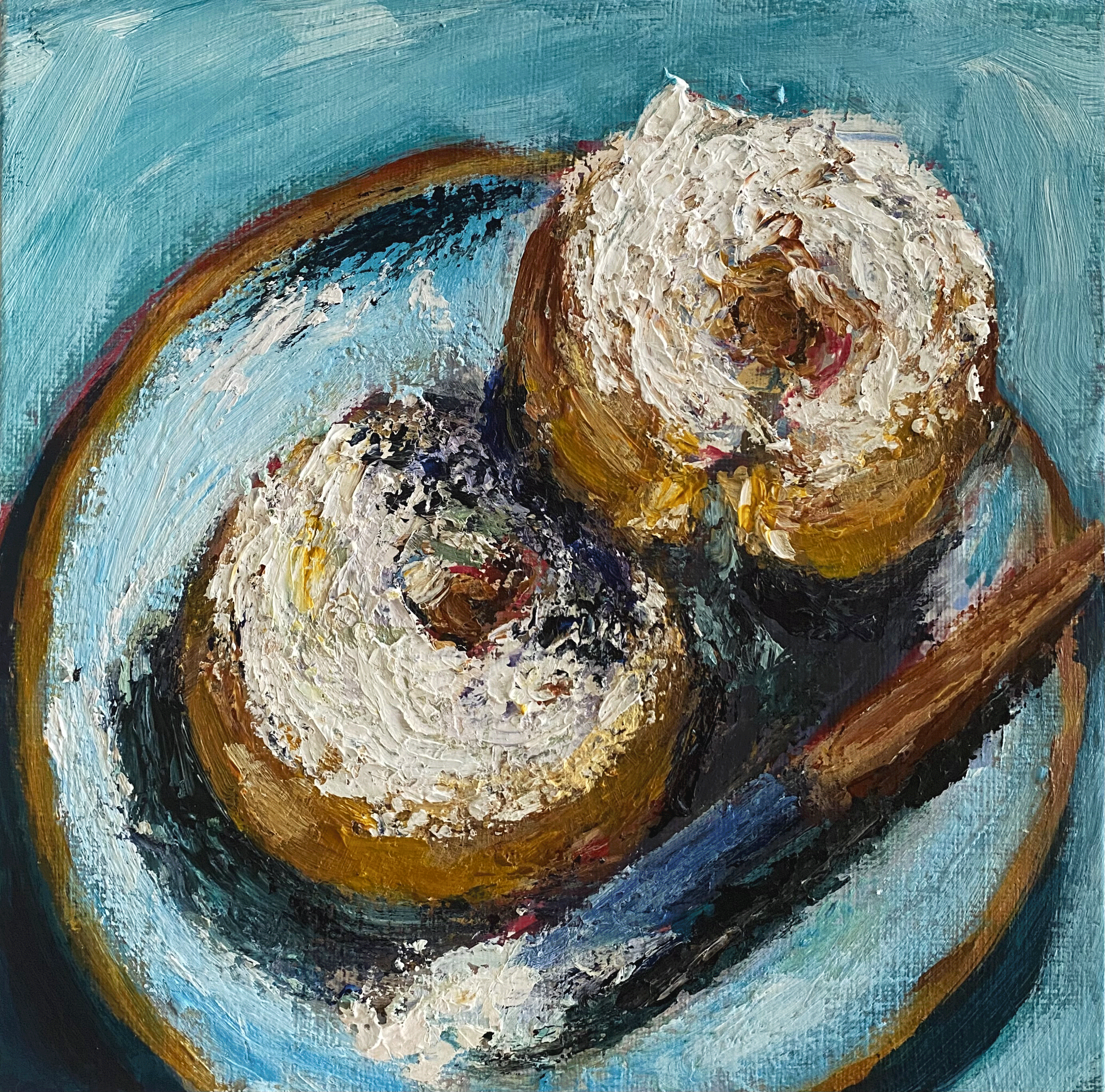 bagels with cream cheese on teal background.png