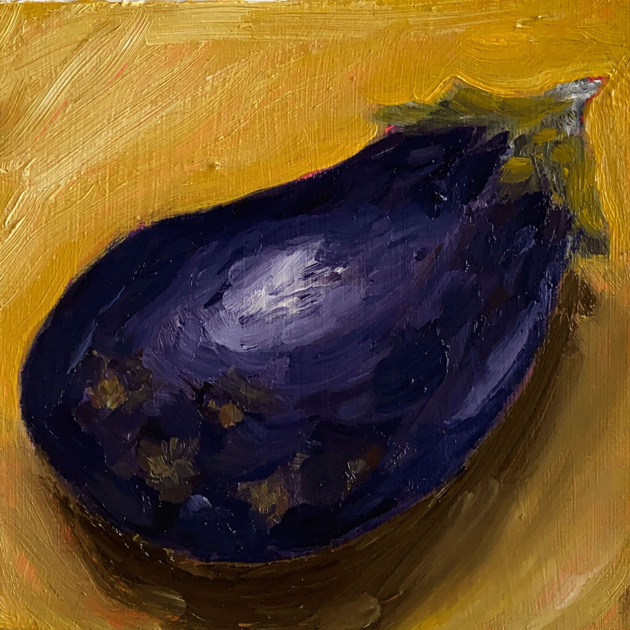 eggplant on yellow background close up.png