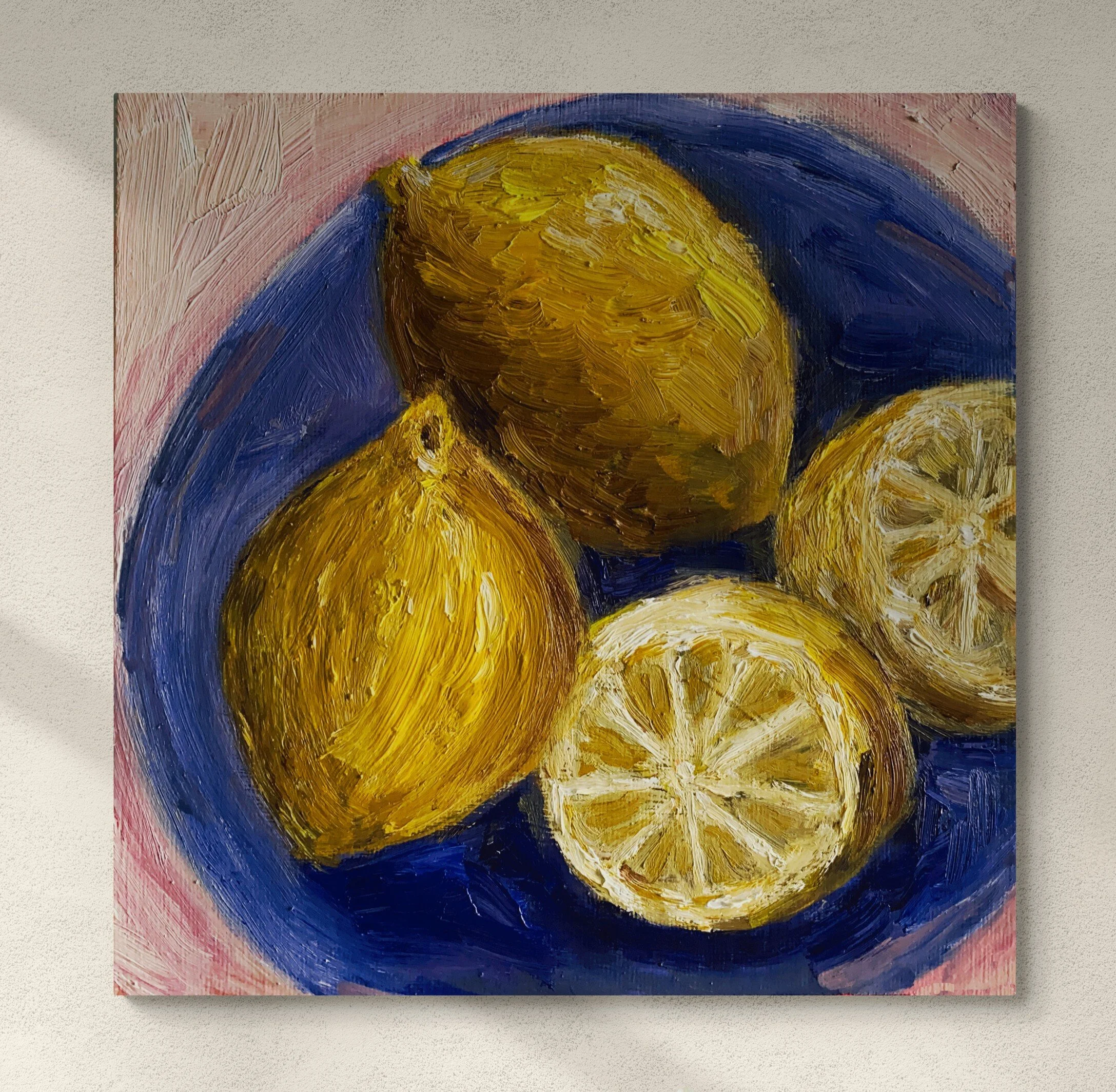 lemons and lemon slices on blue plate