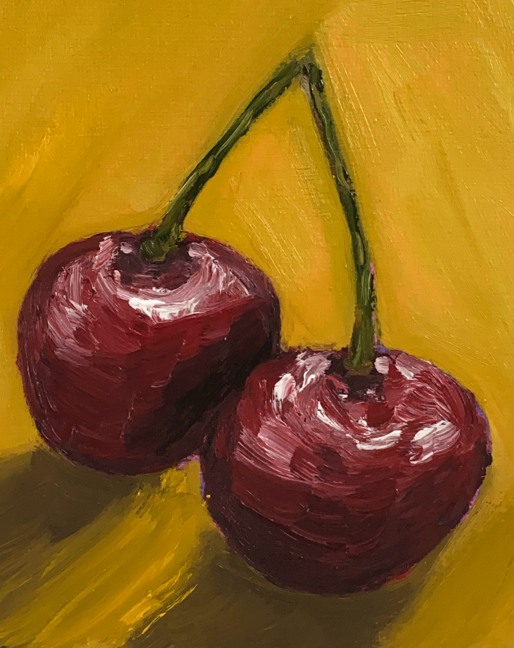 cherries on yellow background close up.png
