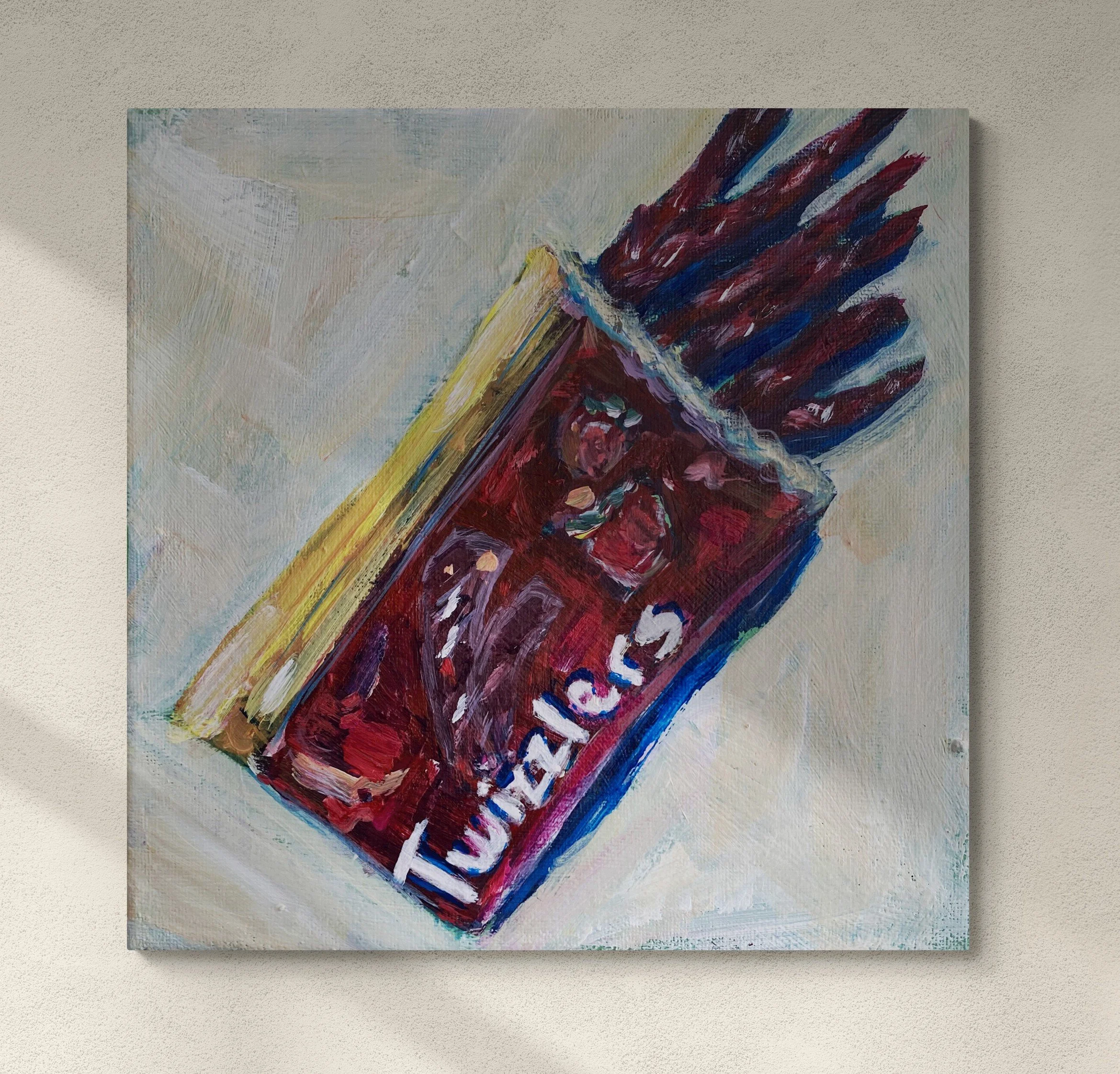 red bag of twizzlers on white background hung on wall.jpg