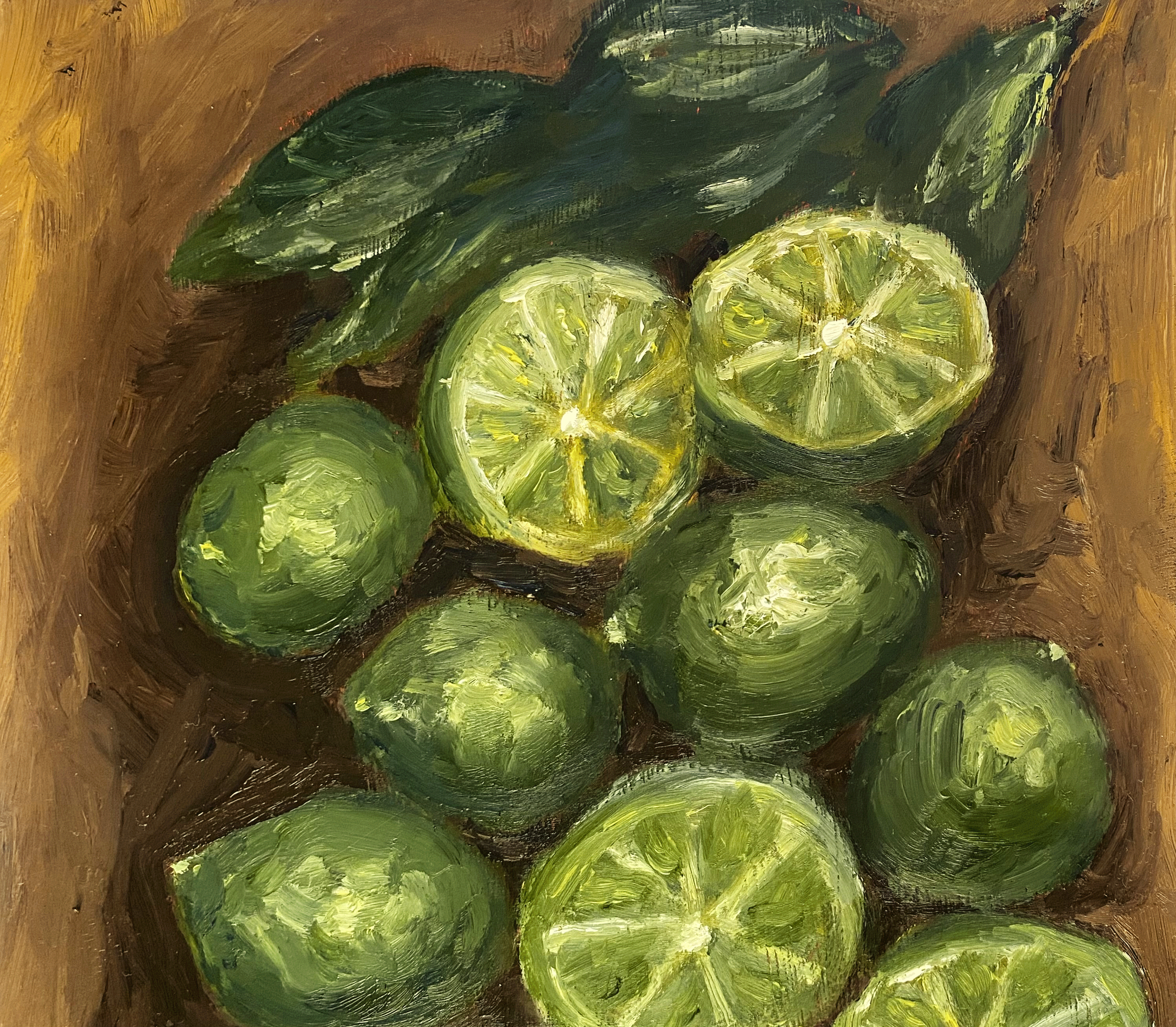 green limes on wood table.png