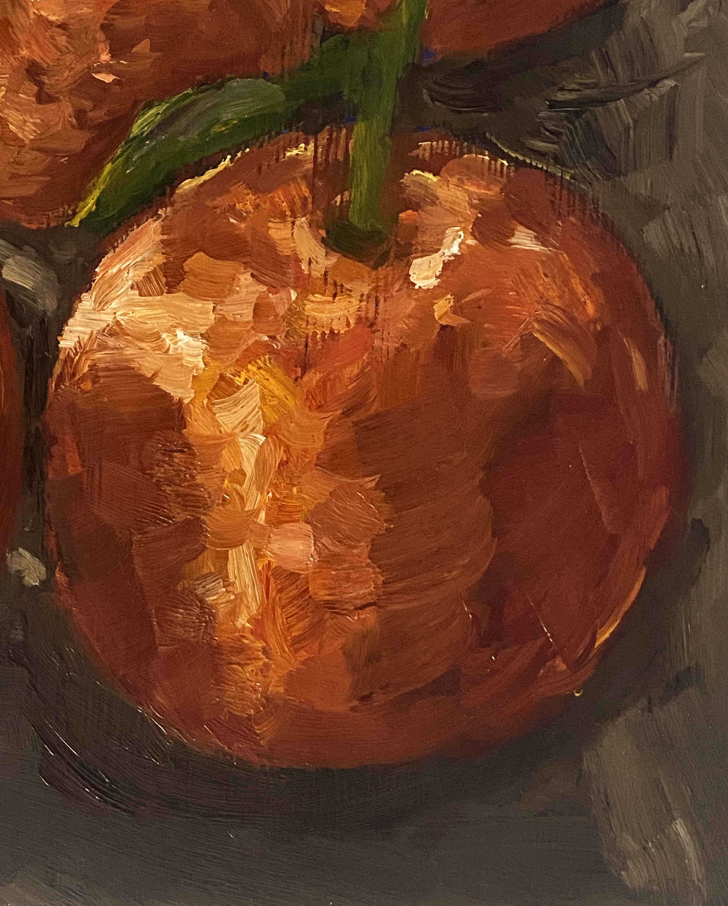 Close up of mandarin on counter top.png