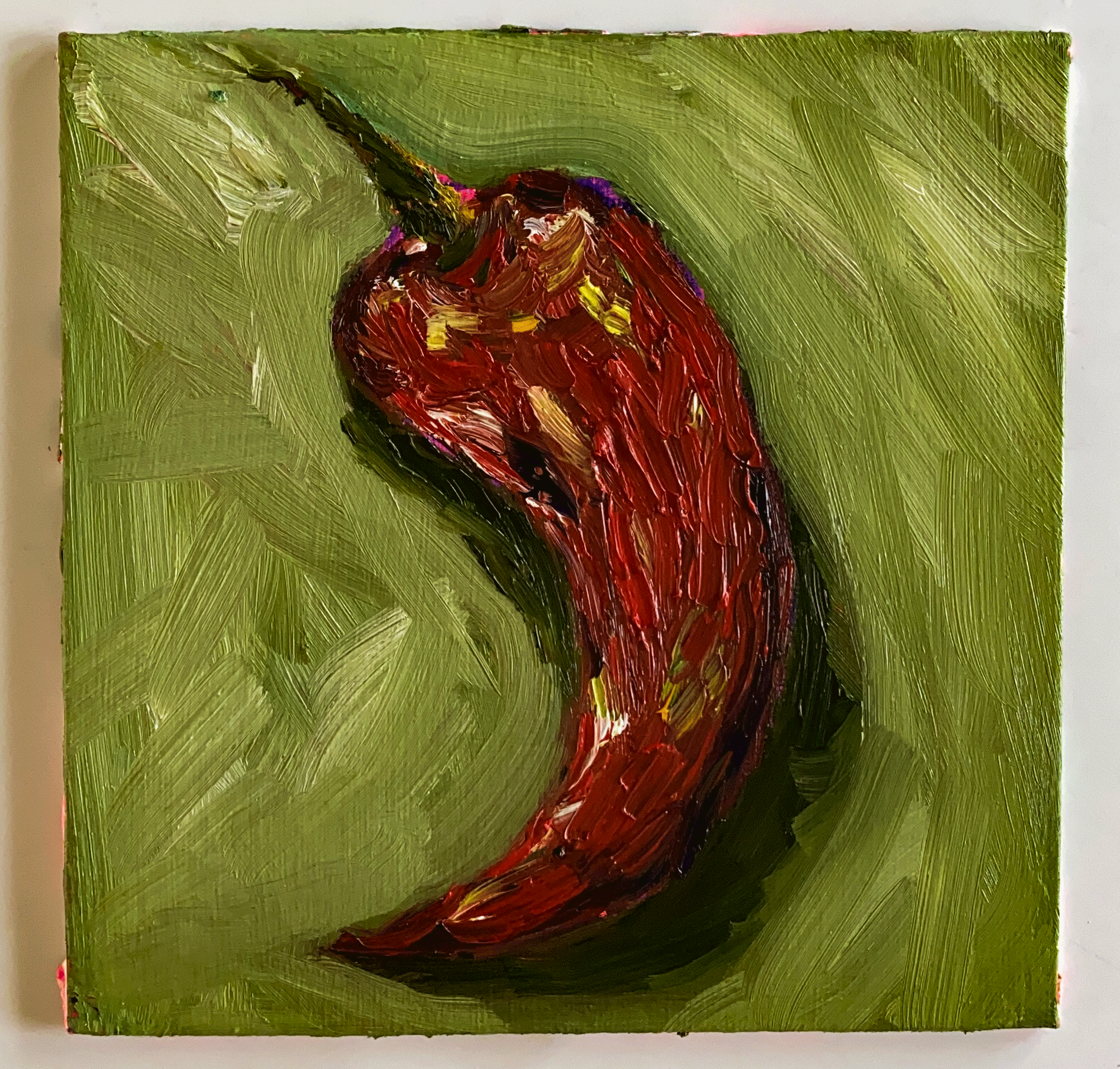 red chili pepper on green background.png
