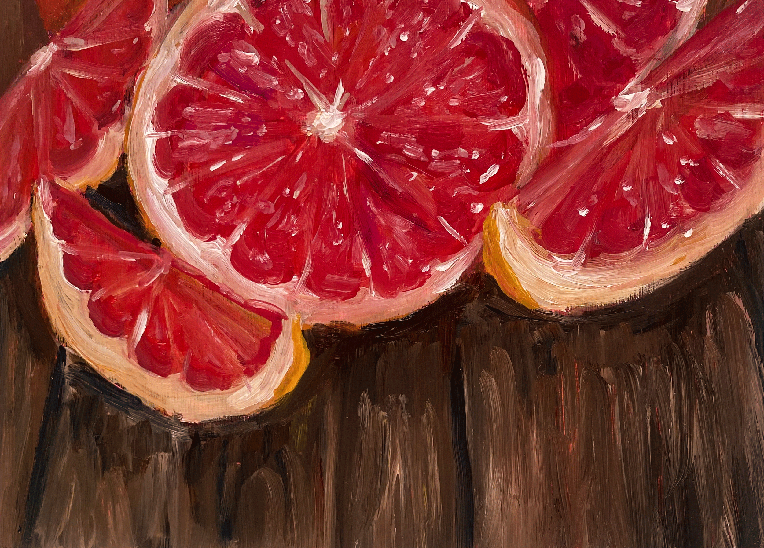 Closeup of grapefruit on table.png