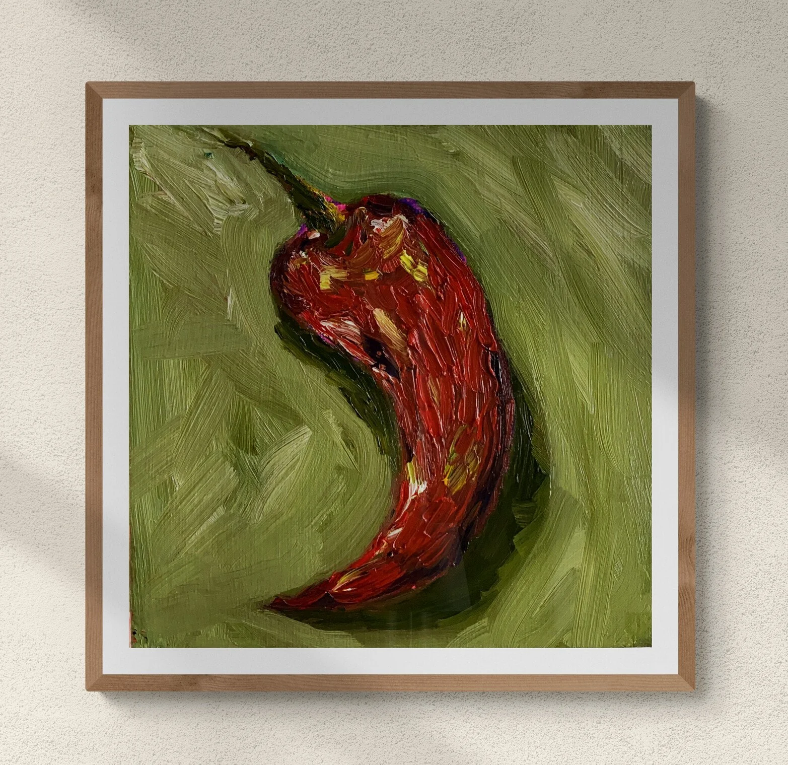 red chili pepper on green background framed hung on wall.jpg