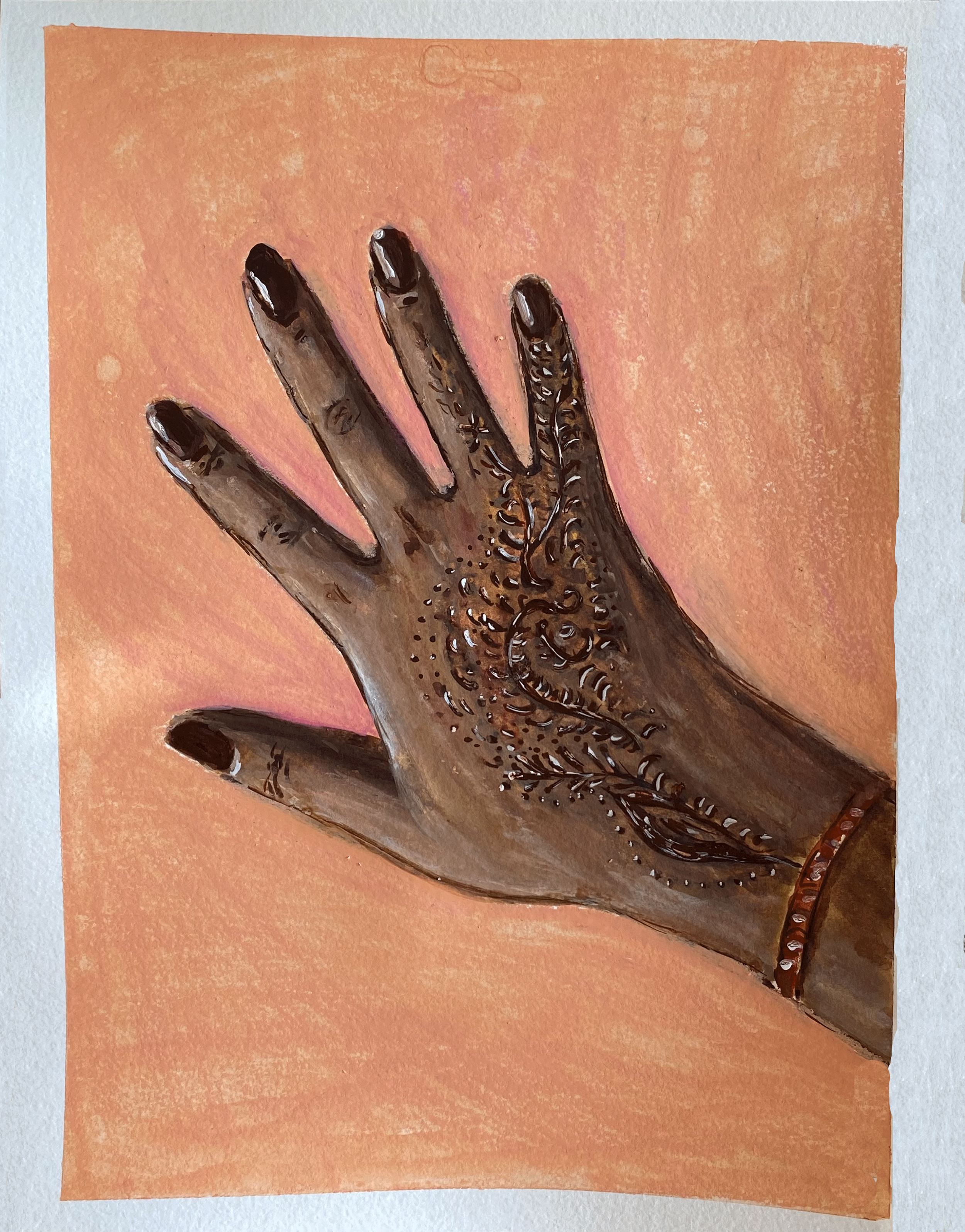 hand with henna tattoo on peach background.png