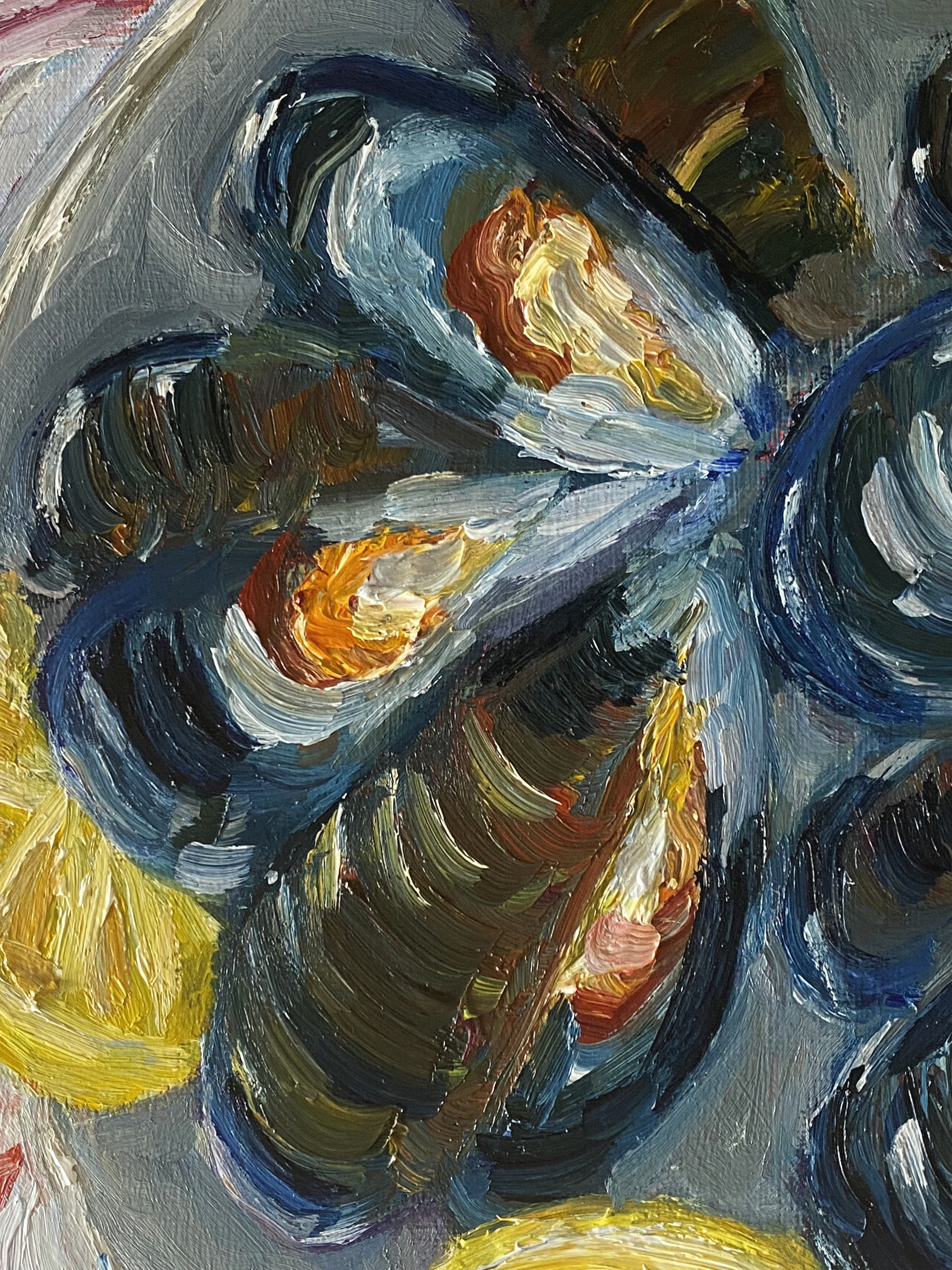 blue mussels with lemon slices on plate.png