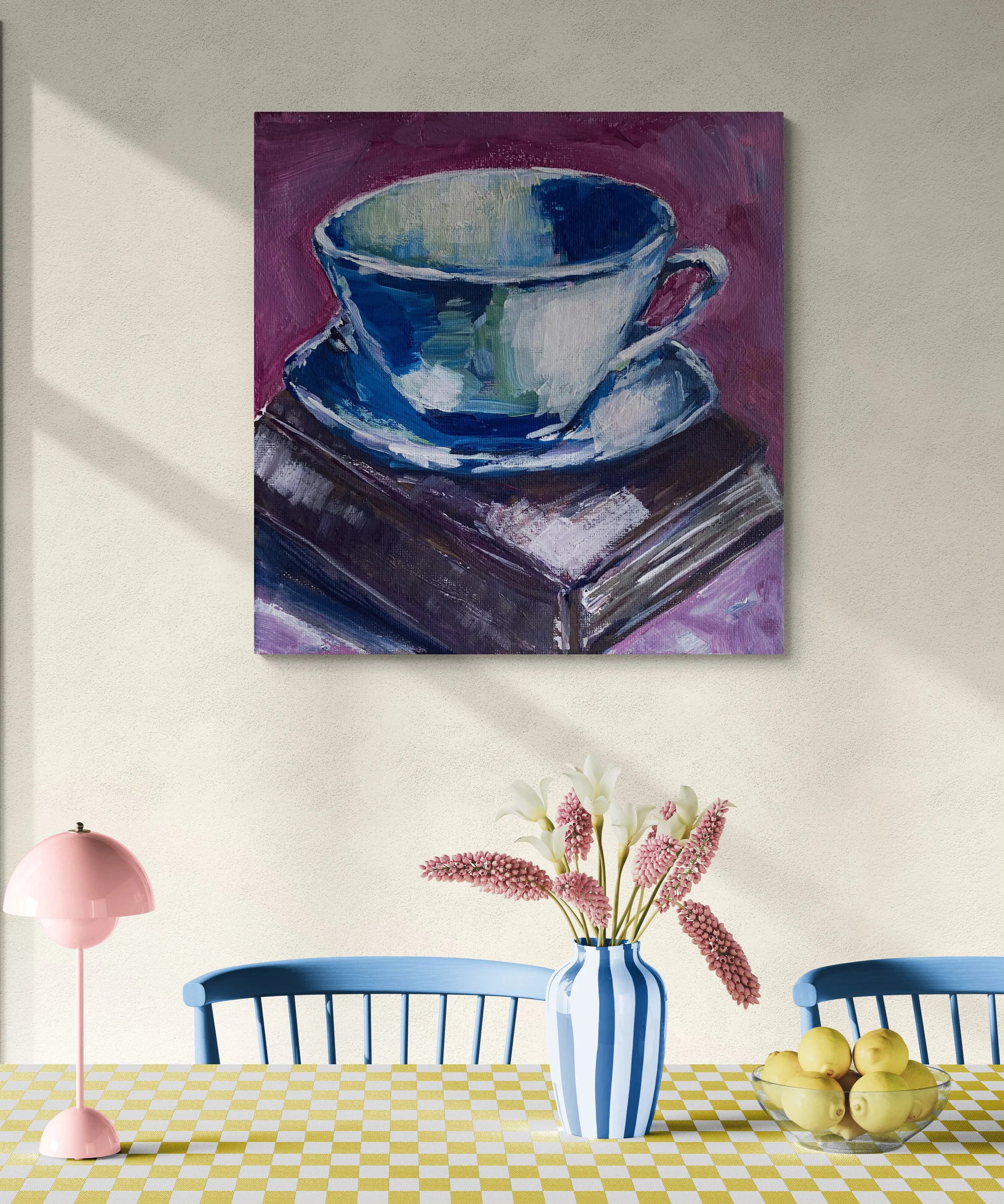 white coffee cup and saucer on brown book on purple background hung on wall dining room.jpg