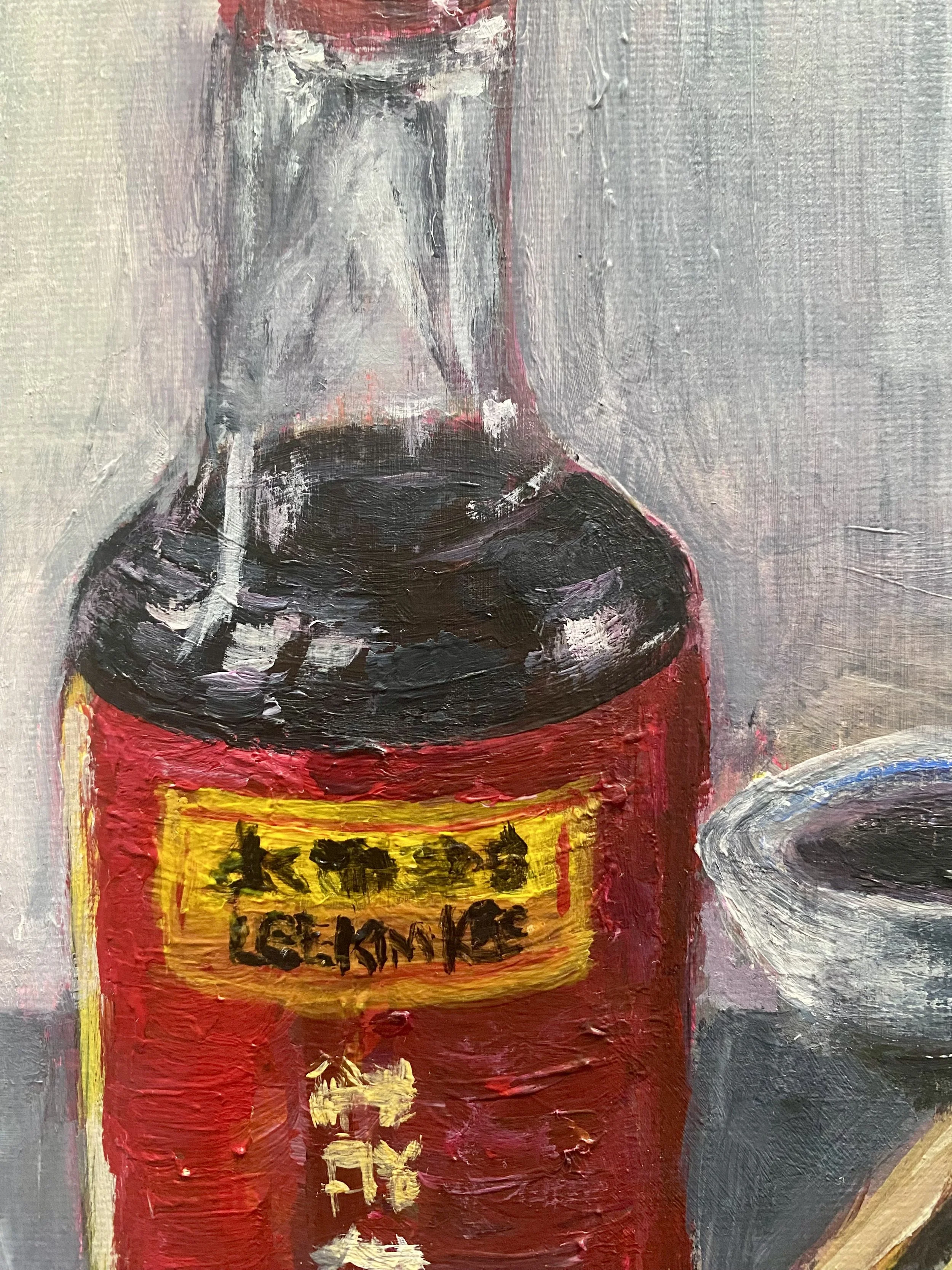 soy sauce bottle with small bowl and chopsticks on grey background close up.jpg