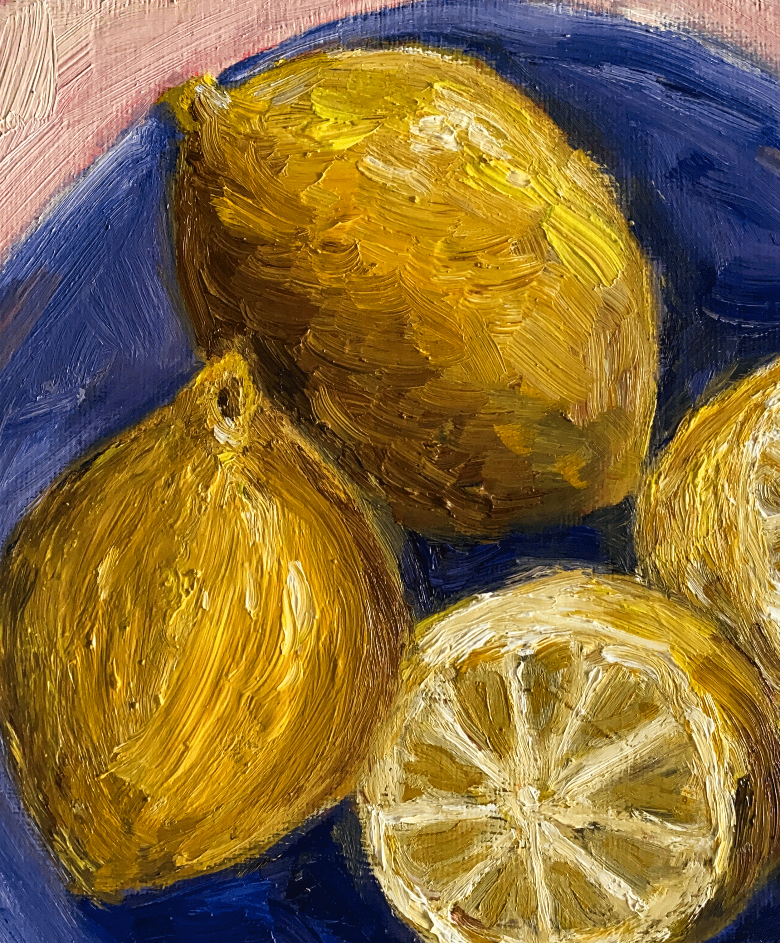 lemons on blue plate close up
