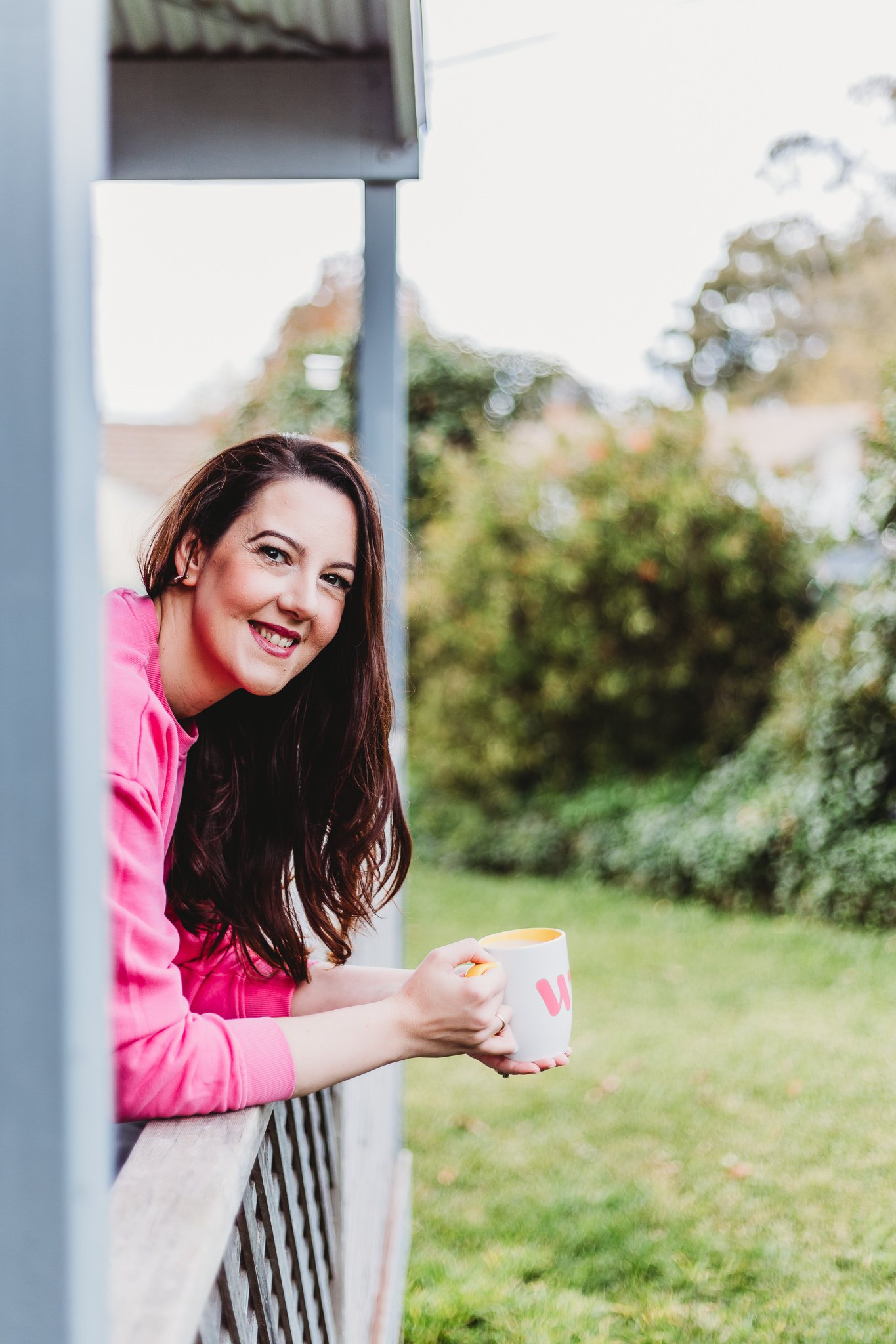 Branding photographer - woman smiling with cup of tea