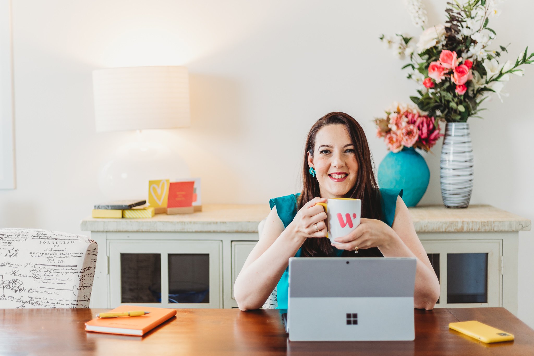 Canberra branding photographer - woman drinks tea at desk