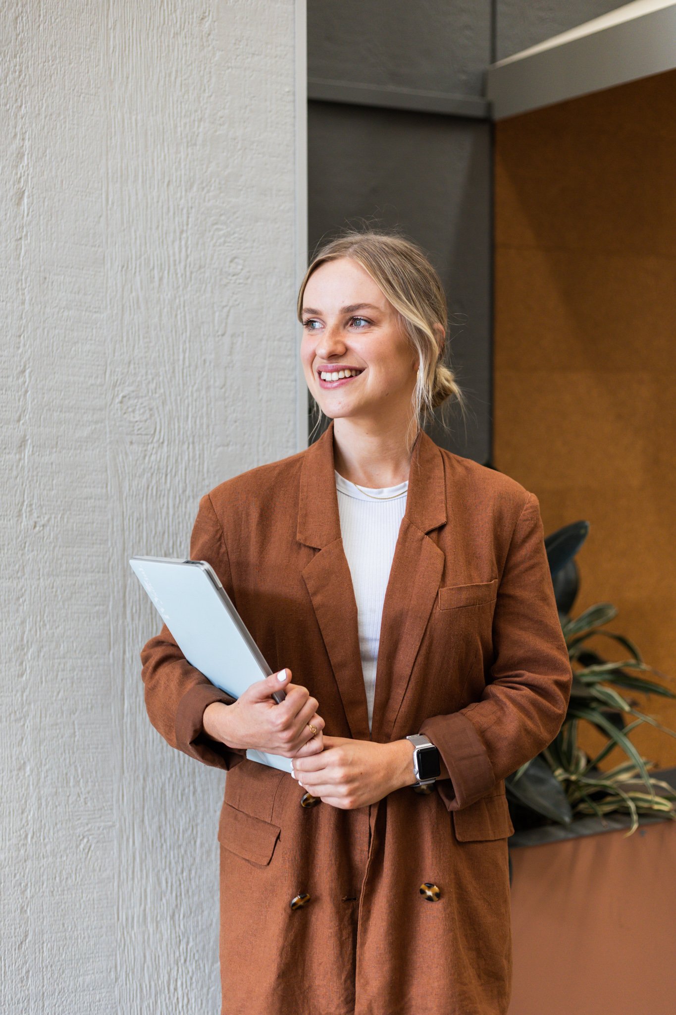 Canberra branding photographer - confident woman holding laptop