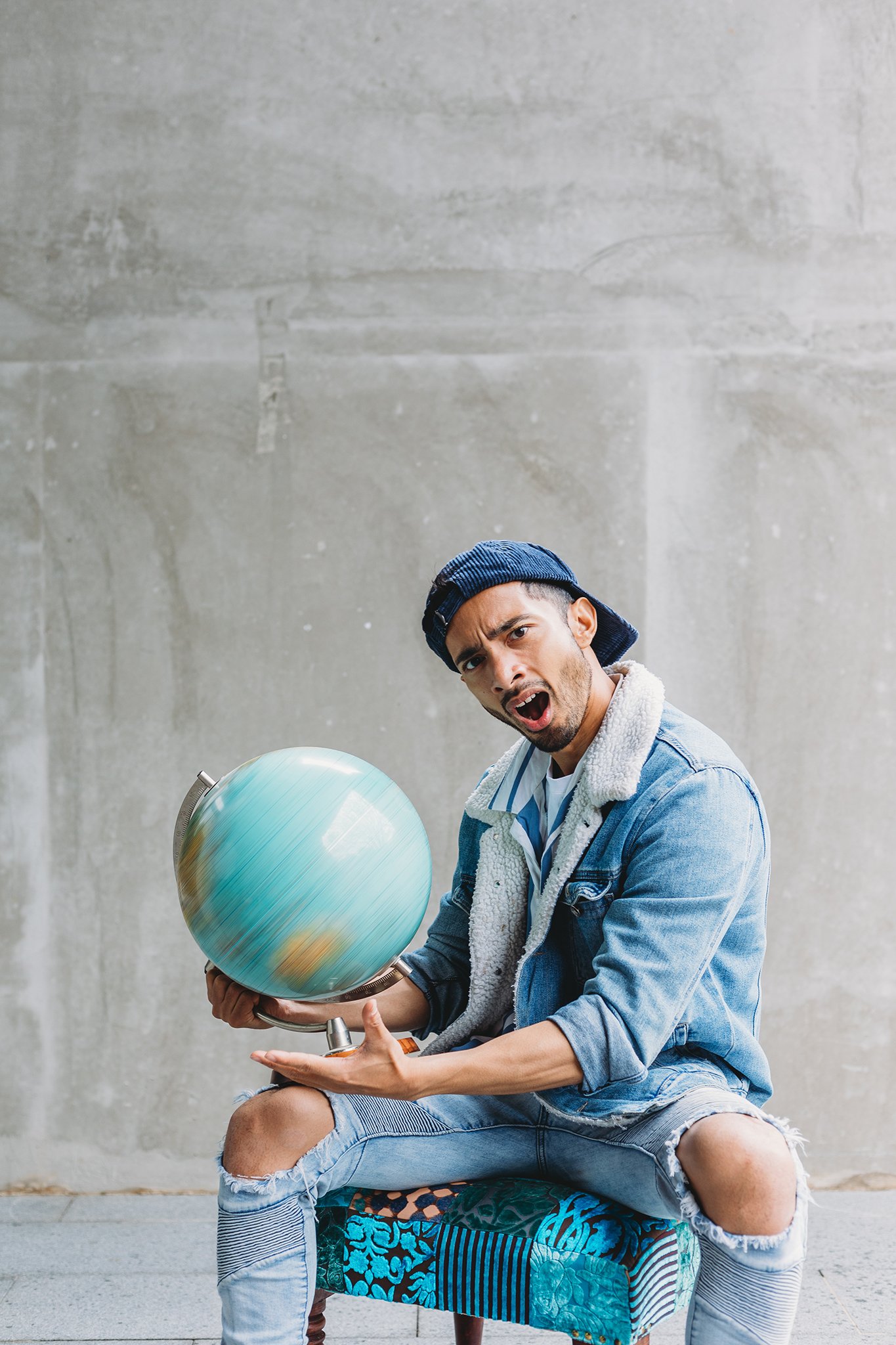 Canberra Branding Photography - man spins globe