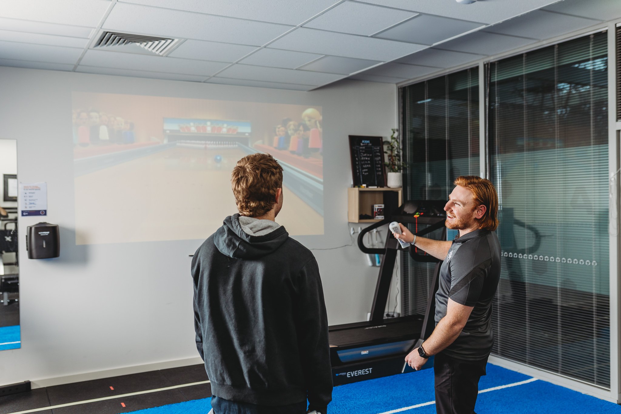 Canberra Branding Photography - men jovially play videogames