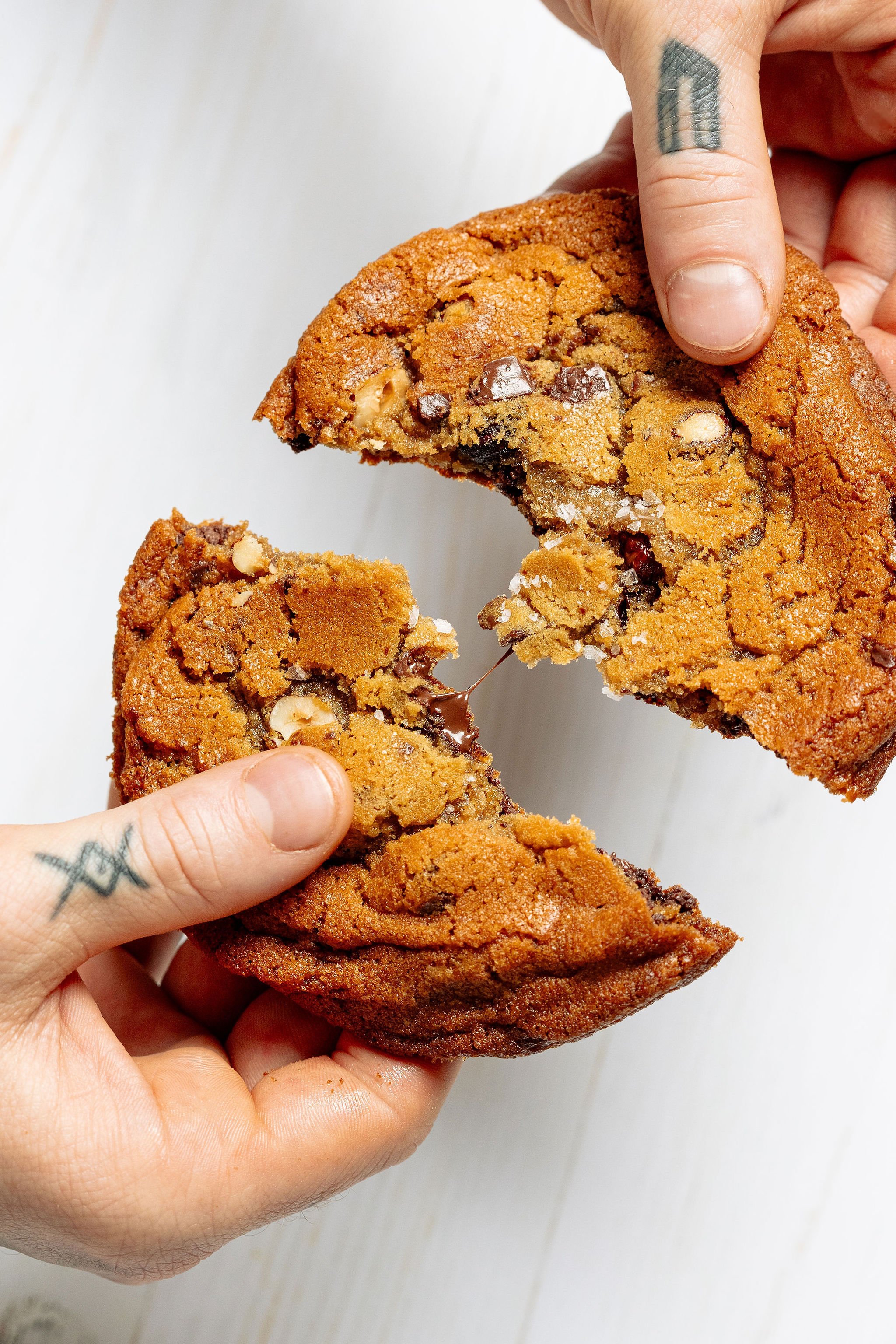 Food photography - hands break apart cookie