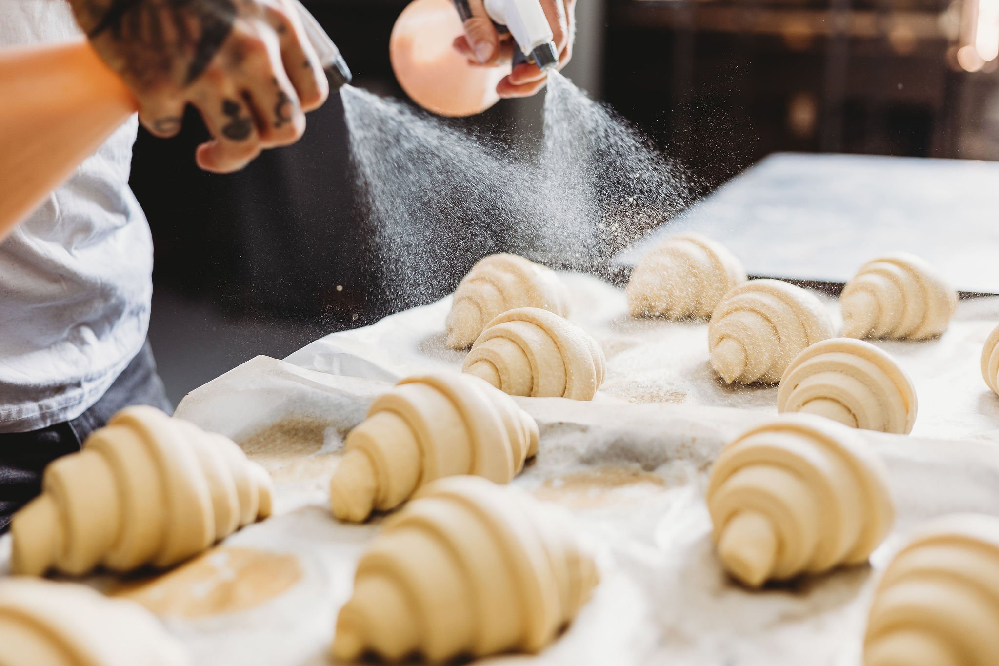 Canberra food photography - spraying butter on croissants