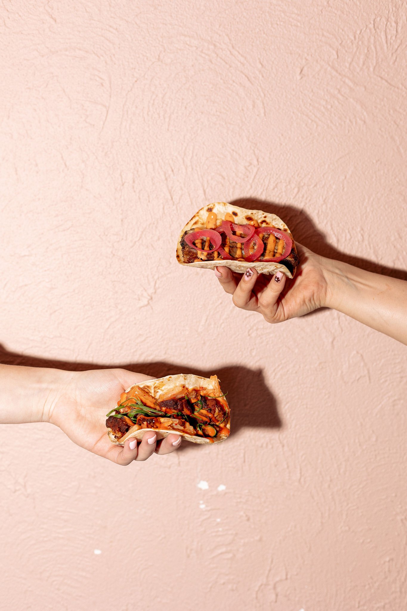 Canberra food photographer - hands hold tacos