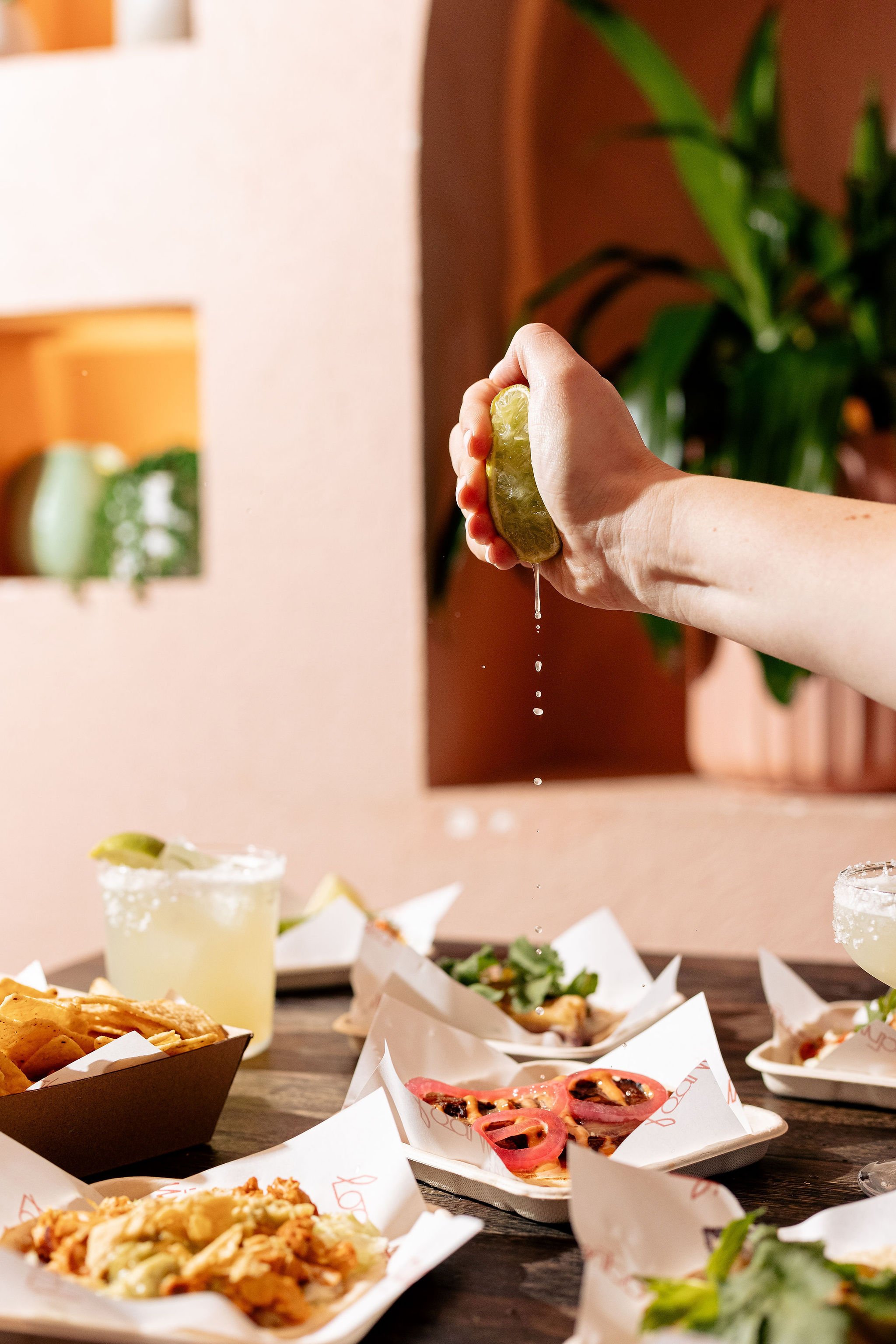 Canberra food photography - hand squeezes lime on tacos