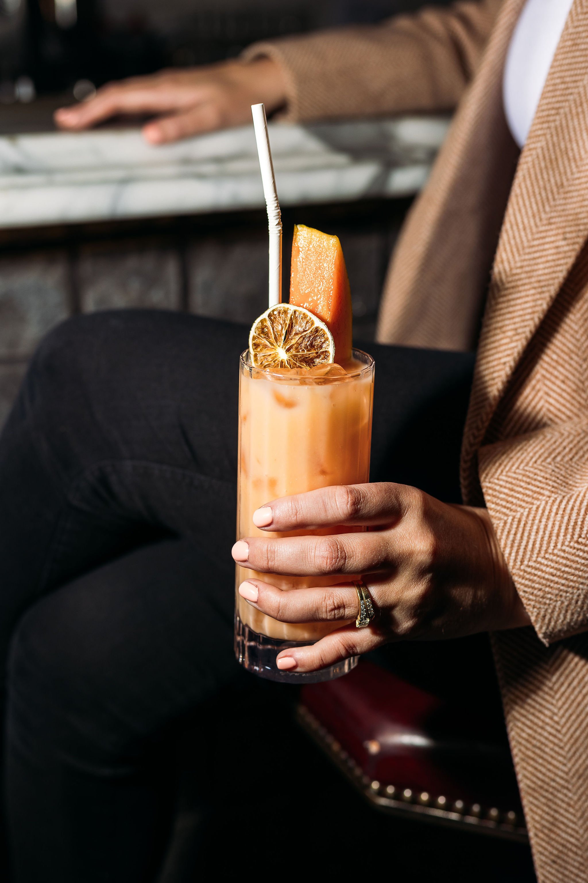 Canberra food photographer - woman holds cocktail