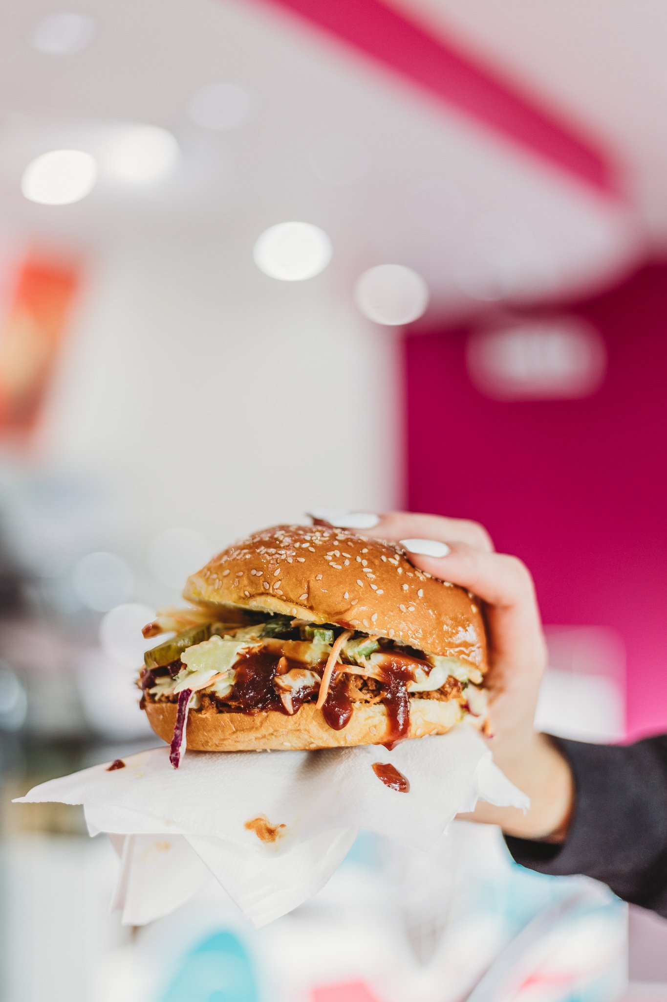 Canberra food photography - hand holds pulled pork burger (Copy)