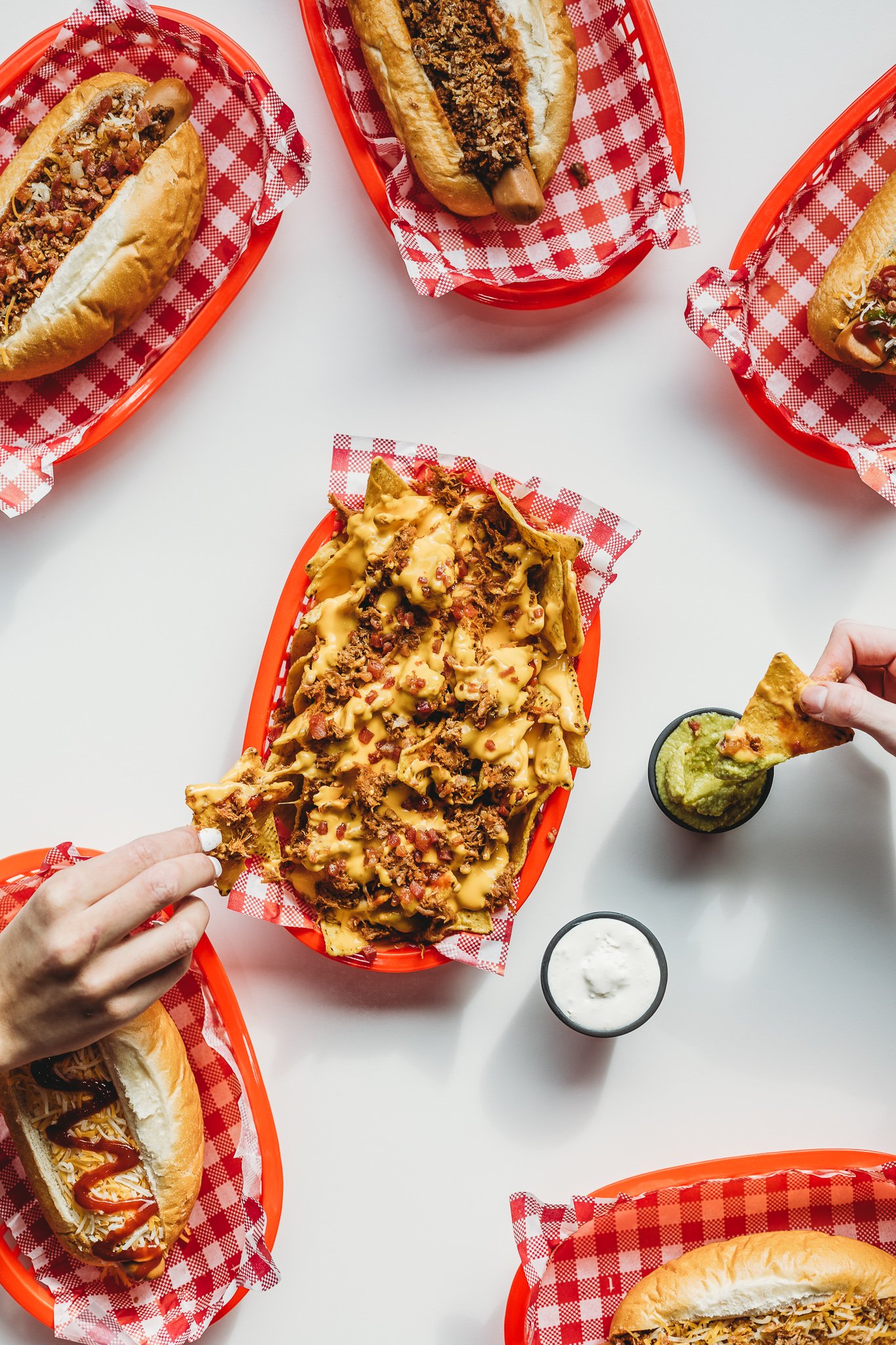 Canberra food photography - hands reach for nachos (Copy)