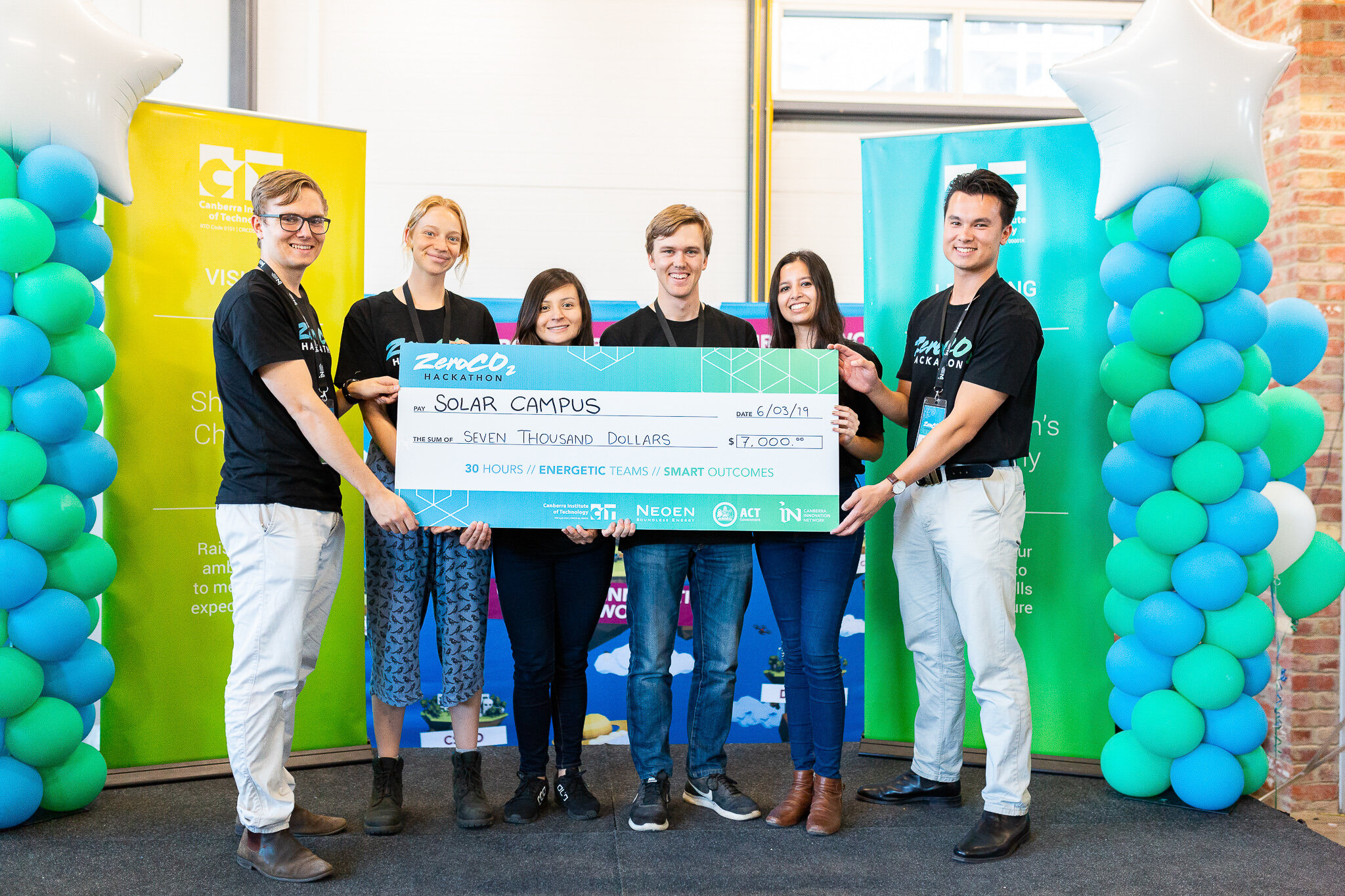 Canberra Event Photographer - Group hold giant cheque