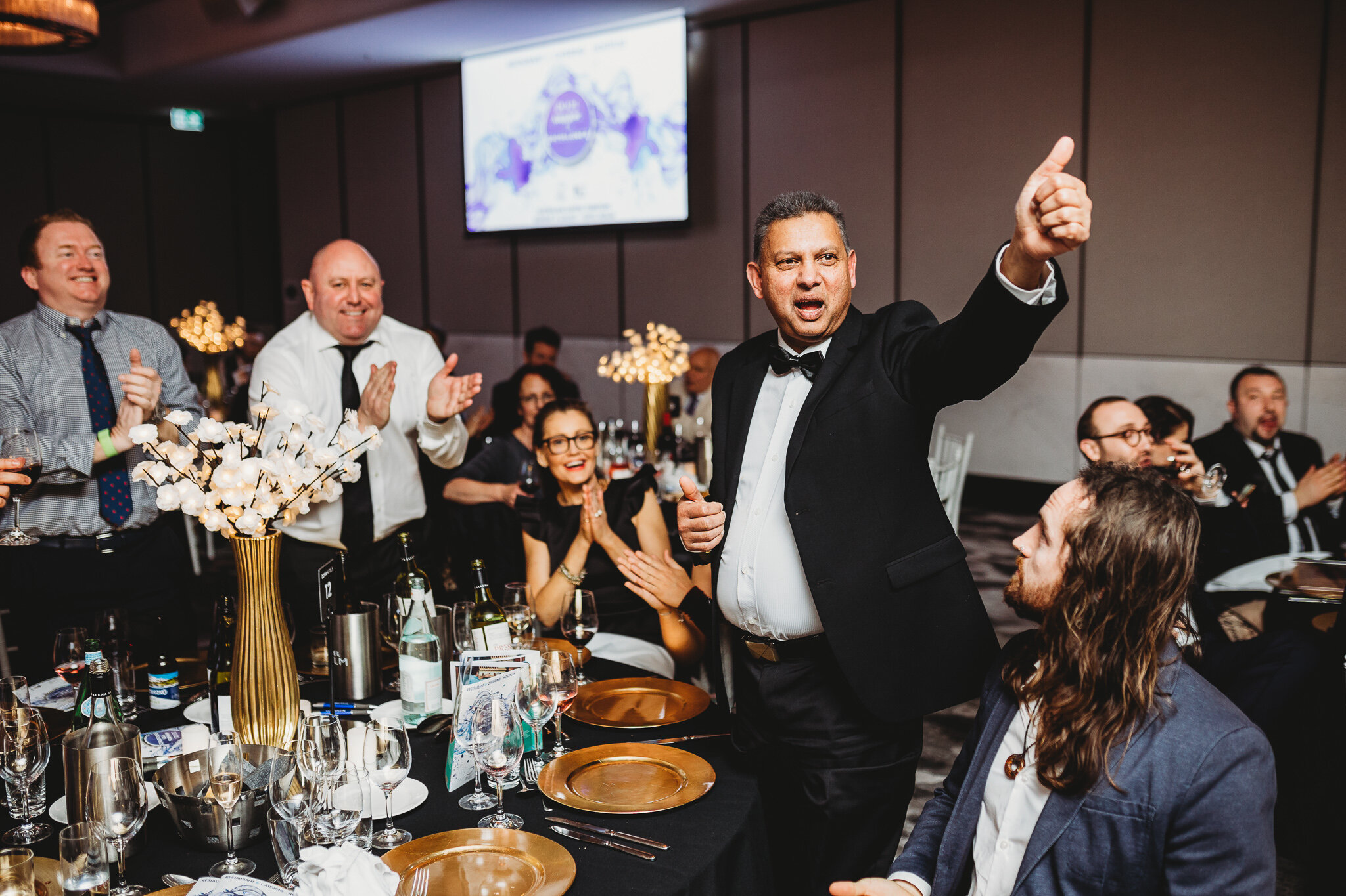 Canberra Event Photography - Enthusiastic man at table