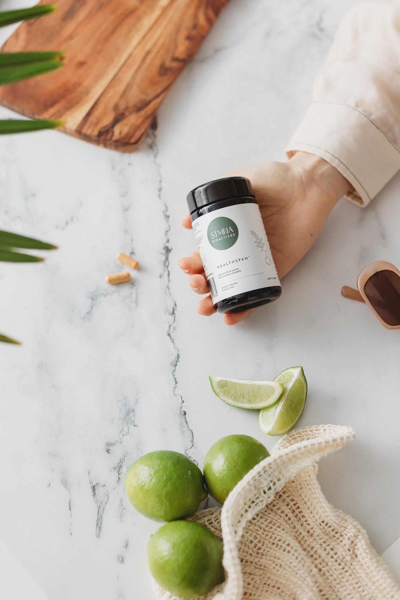 Canberra product photography - female hand holds vitamins